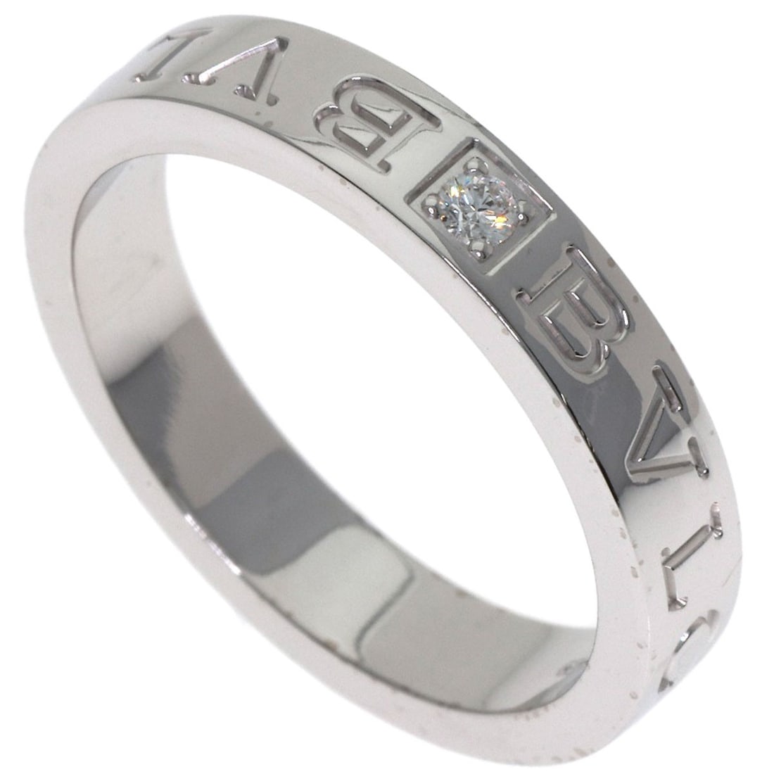 Diamond Ring K18 White Gold Double Logo: Diamond Ring K18 White Gold Double Logo K18 White Gold Double Logo Ring Features a Diamond Stone. This BVLGARI Style Ring is Made from K18 Purity Gold, with a Silver Exterior Color and Silver Metal