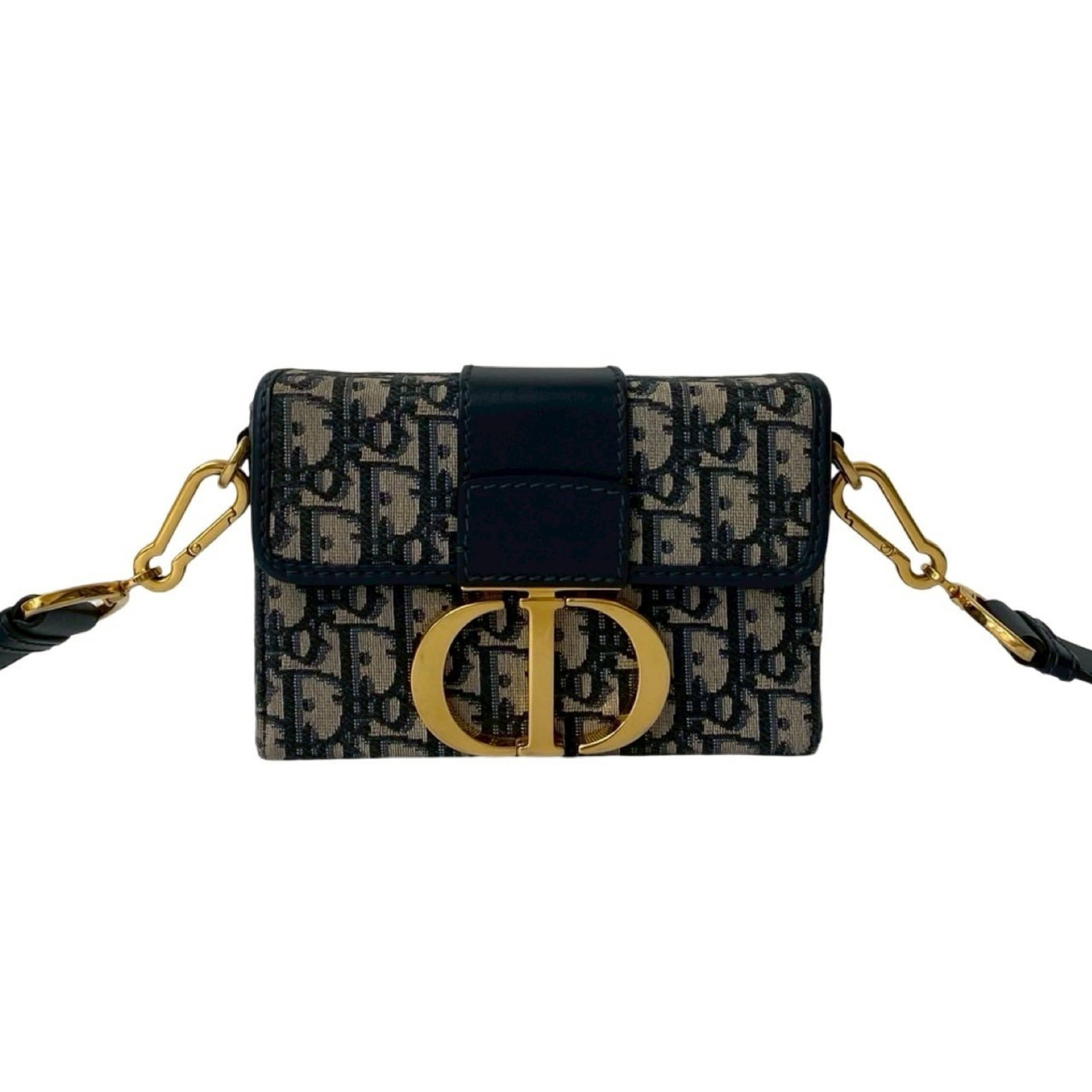 Canvas leather shoulder bag Christian Dior: Canvas leather shoulder bag Christian Dior Navy canvas and leather shoulder bag from Christian Dior, measuring 12cm x 17.5cm x 5.5cm. This bag features a unique combination of materials and colors, wi