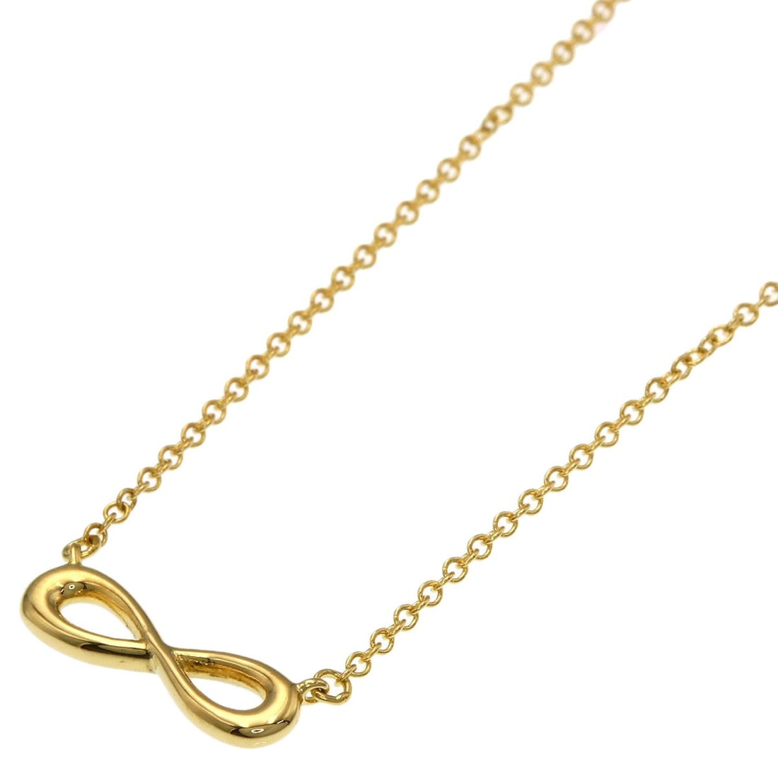 Tiffany Co K18 Yellow Gold Infinity Necklace: Tiffany Co K18 Yellow Gold Infinity Necklace K18 Yellow Gold Infinity Necklace from Tiffany & Co. stands out with its elegant design and luxurious material, crafted from high-quality K18 yellow gold. 