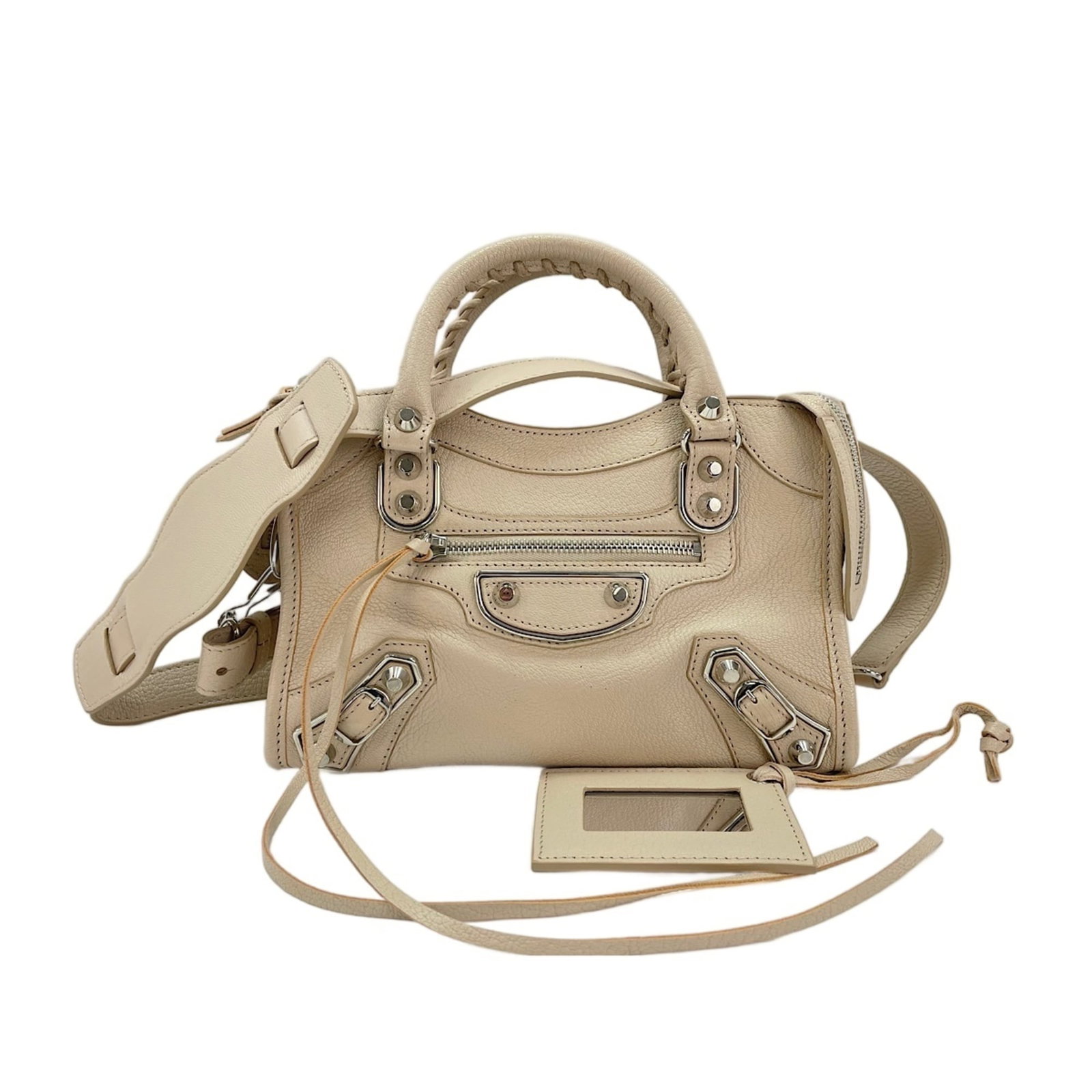 Handbag by Balenciaga: Handbag by Balenciaga Balenciaga's beige handbag boasts clean lines and a compact size, making it perfect for everyday carry. With dimensions of 15cm x 24cm x 9cm, this stylish accessory is designed