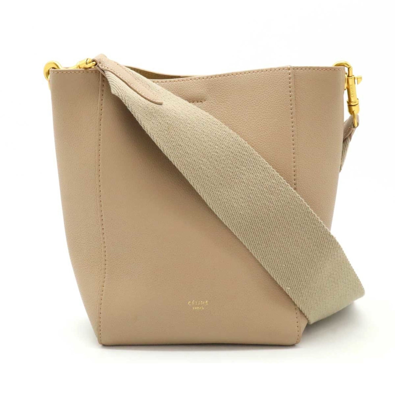 Celine bag leather: Celine bag leather Beige Celine bag leather, featuring a zipper pocket and open pocket for organization. This shoulder bag measures 24cm x 17.5cm x 11cm and has an adjustable strap length of 84cm. Mad