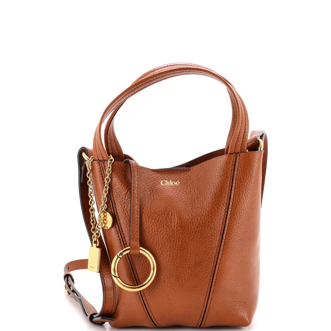 Spin Tote Leather Small Chloe: Spin Tote Leather Small Chloe Small Chloe Spin Tote Leather Cross Body Bag in Brown. This stylish bag features leather exterior, gold hardware, and interior with minor scuffs and discoloration. Minor 