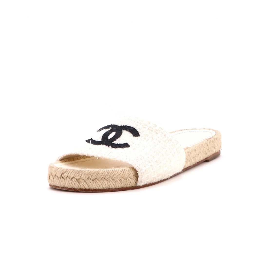 Chanel Women's CC Espadrille Slide Sandals Tweed: Chanel Women's CC Espadrille Slide Sandals Tweed Tweed upper and jute, leather interior details the Chanel Women's CC Espadrille Slide Sandals. This classic design features black and white exterior co