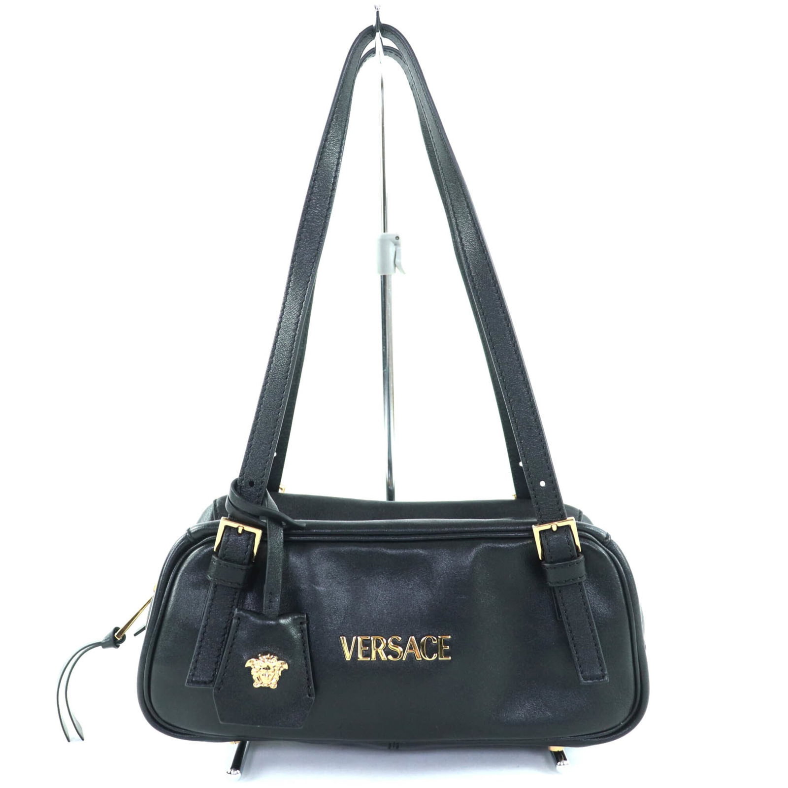 Handbag Leather Versace: Handbag Leather Versace Versace's iconic handbag features sleek black lambskin leather, adorned with a zipper closure and an open pocket for added convenience. With its compact size and stylish