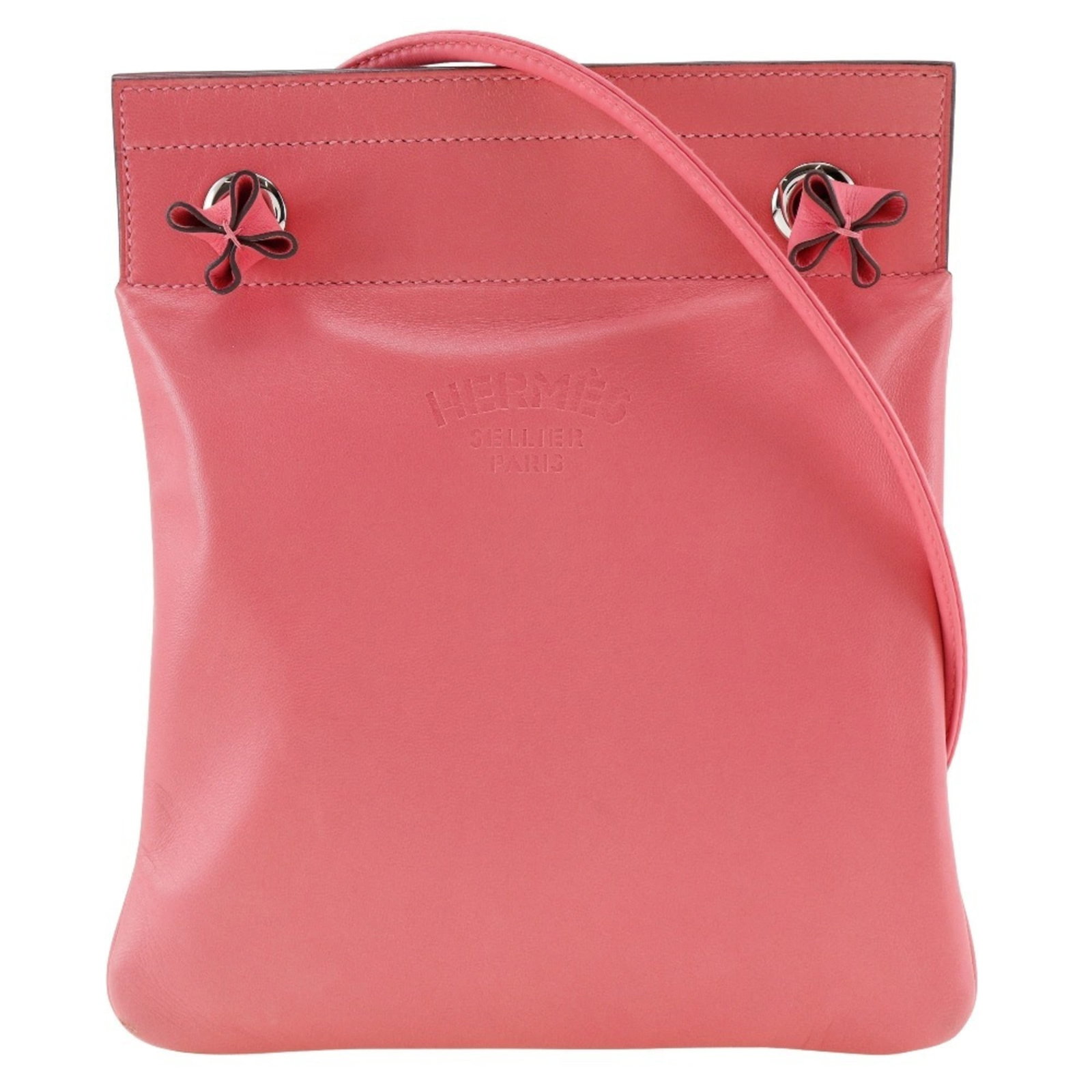 Shoulder bag leather by Hermes: Shoulder bag leather by Hermes Made from high-quality calfskin leather, this pink shoulder bag by Hermes boasts a sleek and sophisticated design. The compact size and stylish color make it an ideal ac
