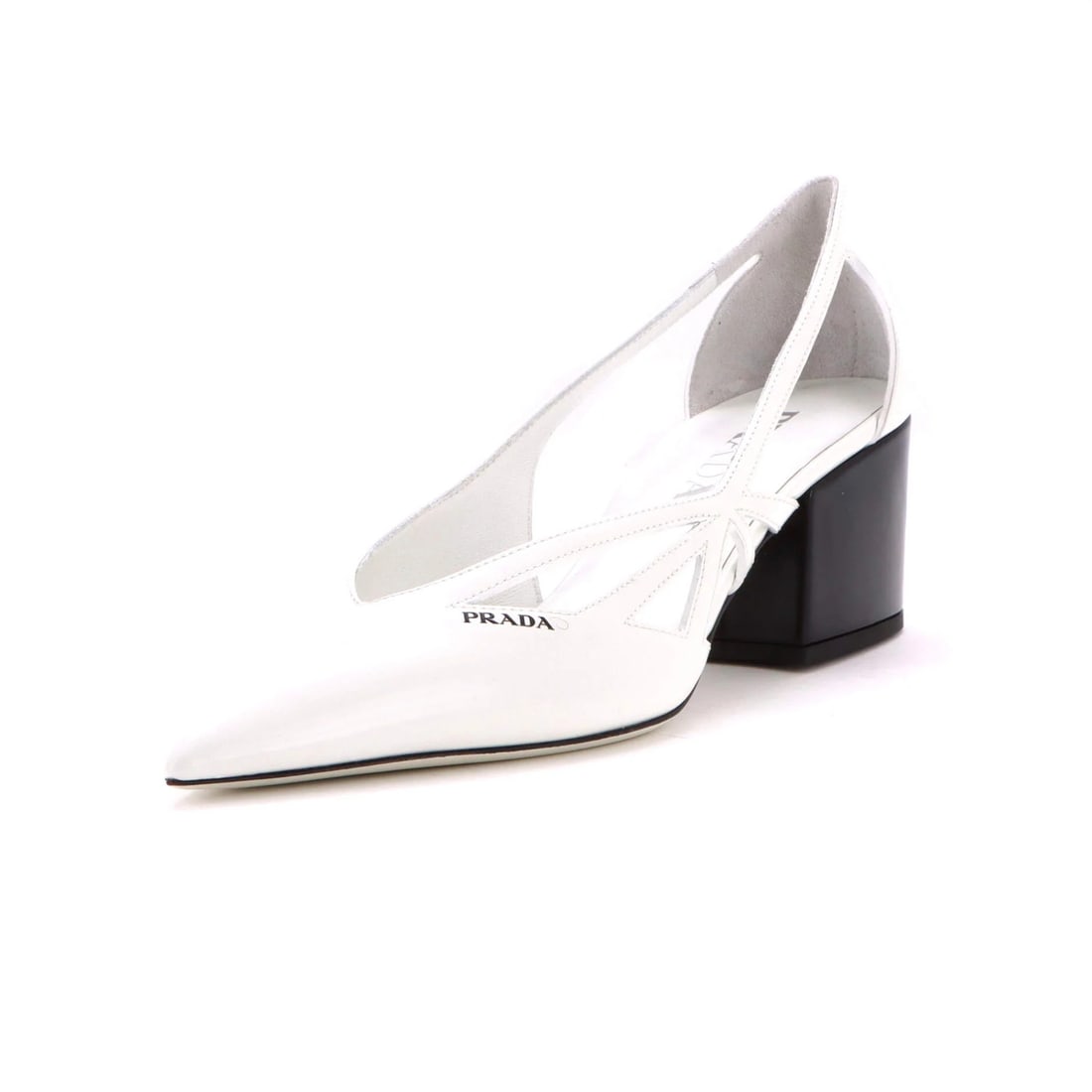 Women's Cutout Pumps by Prada: Women's Cutout Pumps by Prada White leather cutout pumps by Prada, featuring an all-leather upper and interior. Light marks are present throughout the shoes in great condition. The classic design show