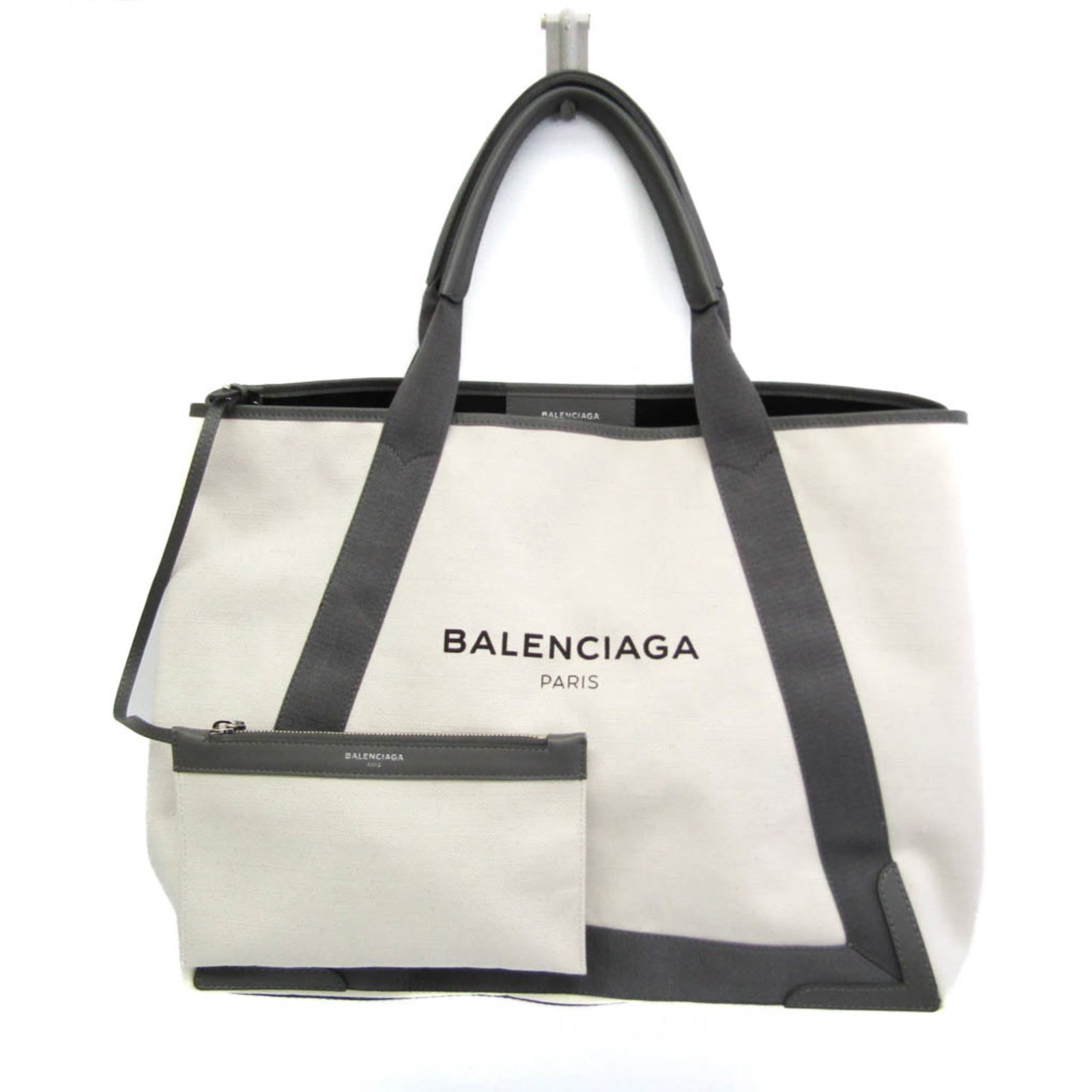 Canvas leather bag tote by Balenciaga: Canvas leather bag tote by Balenciaga Canvas leather bag tote by Balenciaga, featuring cream and gray color combination with silver hardware. Made from canvas and leather materials, this navy cabas M 