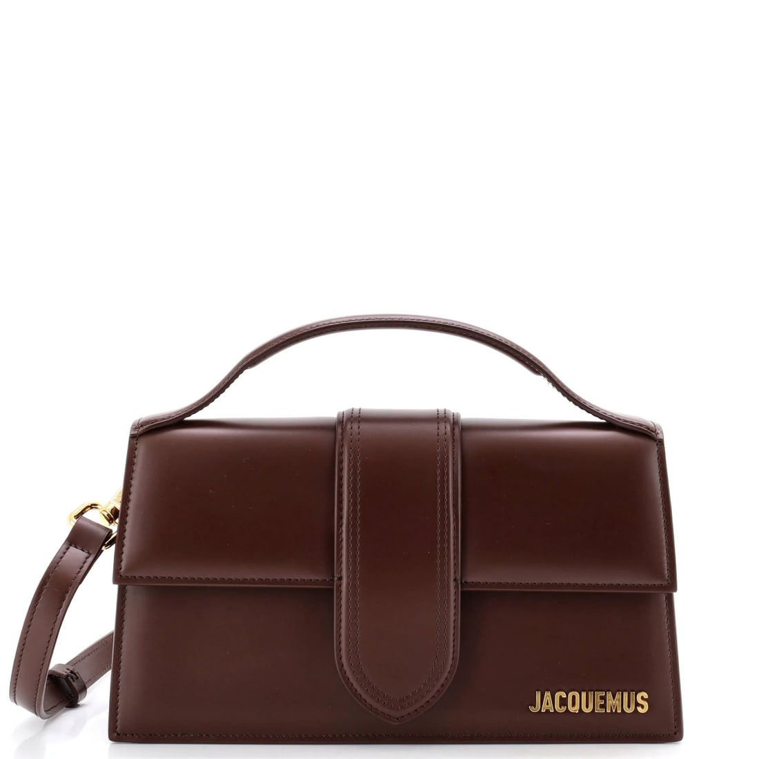 Leather flap bag bambino grand by Jacquemus: Leather flap bag bambino grand by Jacquemus Brown leather cross body bag with gold hardware, featuring a flap closure and adjustable strap. The bag has scuffs, edge wear, corner wear, minor creases on