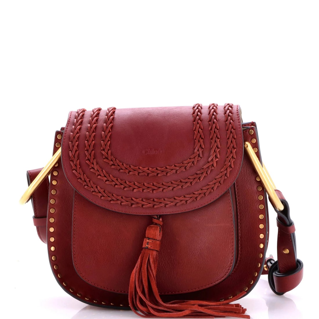 Small leather whipstitch handbag by Chloe Hudson: Small leather whipstitch handbag by Chloe Hudson Small leather whipstitch handbag by Chloe Hudson features a rich burgundy exterior with gold hardware. The interior boasts neutral suede and measures 8