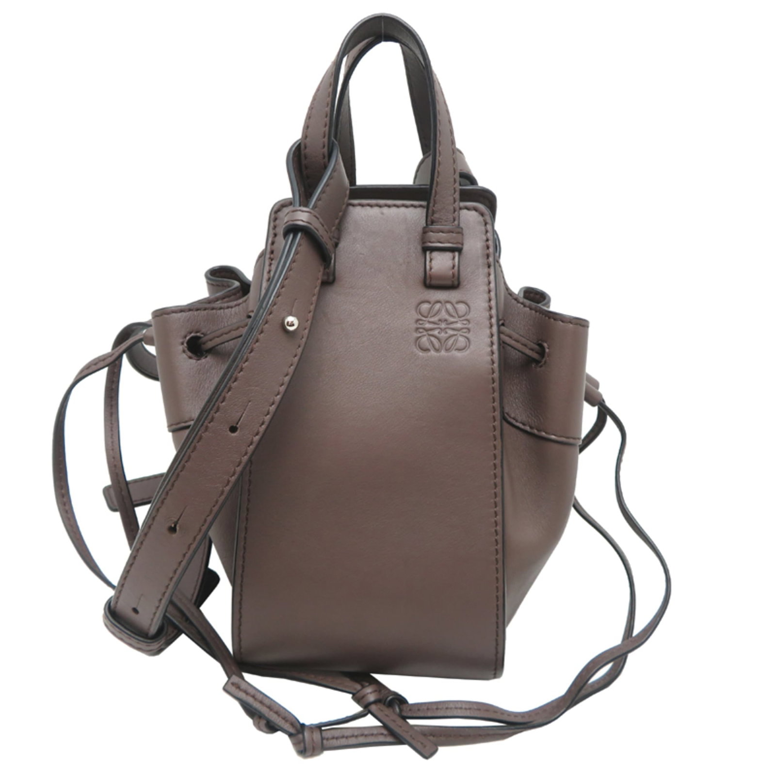 Loewe Handbag Leather: Loewe Handbag Leather Loewe Handbag Leather features high-quality Calfskin leather in a rich Brown color. The classic design boasts a timeless shape with a sturdy Handle Length of 17cm and adjustable