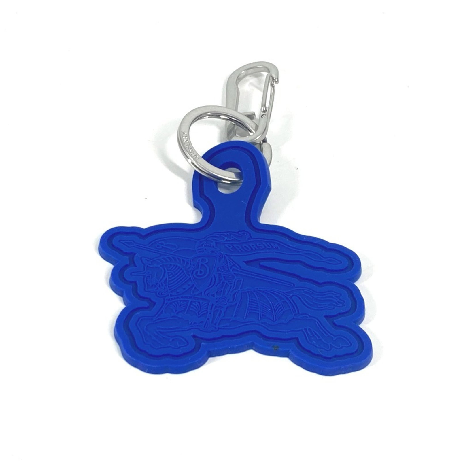 Rubber Keyring Burberry: Rubber Keyring Burberry Blue rubber keyring from Burberry, a stylish accessory for everyday use. Made from durable rubber material, this keyring features the iconic brand's signature style. A simple y