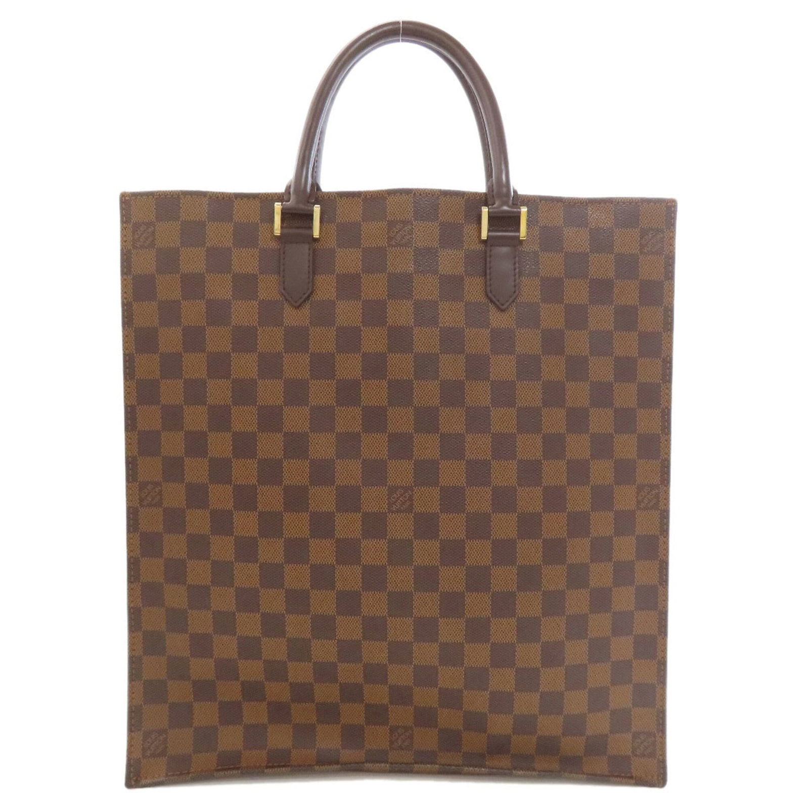 Damier Canvas Tote Bag by Louis Vuitton: Damier Canvas Tote Bag by Louis Vuitton Damier Canvas Tote Bag by Louis Vuitton. This iconic tote bag features the classic Damier canvas pattern, Ebene color, and signature LV monogram. Measuring