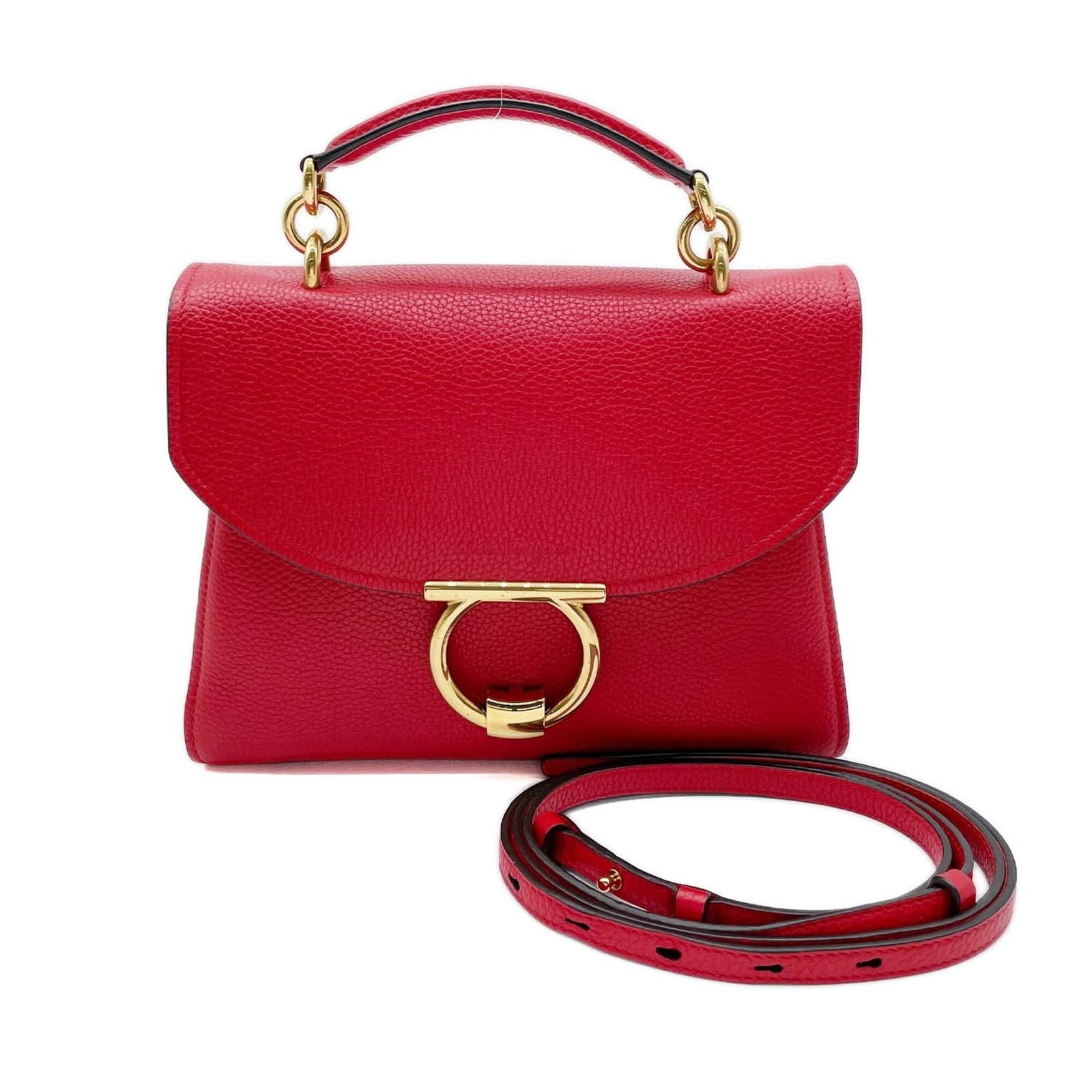 Shoulder bag leather by Salvatore Ferragamo: Shoulder bag leather by Salvatore Ferragamo Red leather shoulder bag by Salvatore Ferragamo, measuring 21.5cm x 26cm x 11cm. This stylish bag features a striking red color and is crafted from