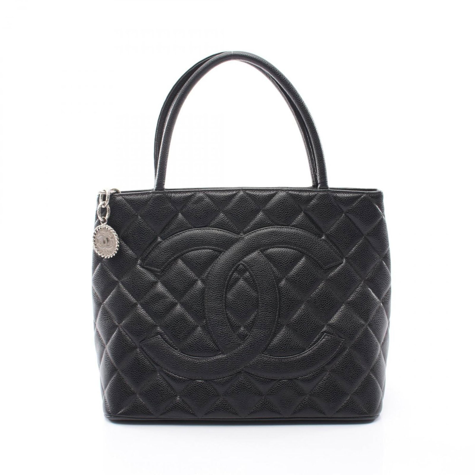 Chanel Handbag Tote Bag Grained Calfskin: Chanel Handbag Tote Bag Grained Calfskin Grained Calfskin Chanel Handbag Tote Bag in Black. This classic tote bag features the iconic design and premium material of Chanel, with a timeless black