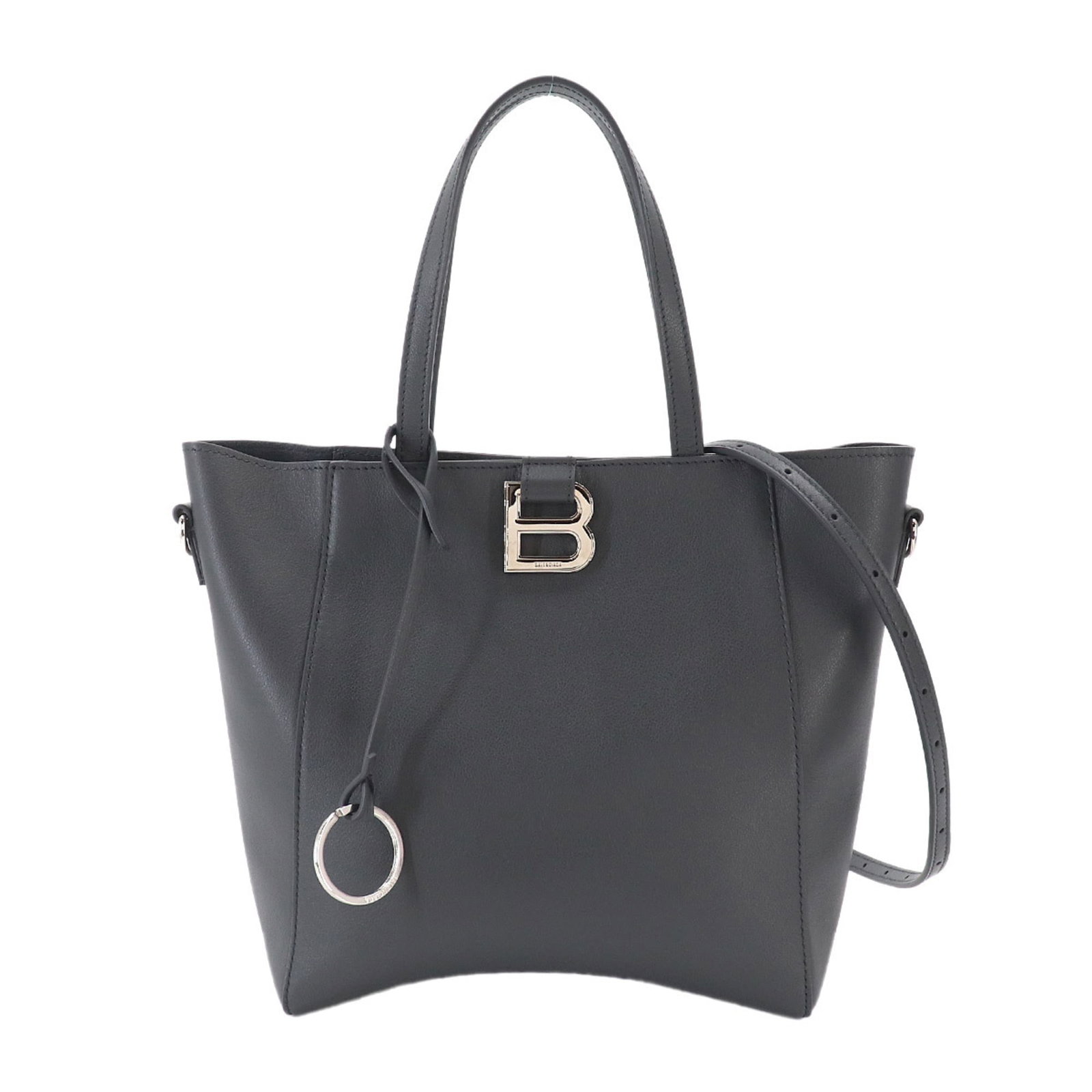 Handbag tote bag leather bag: Handbag tote bag leather bag The Balenciaga leather tote bag boasts sleek, silver hardware and a spacious interior with a zipper pocket for added convenience. Measuring 22cm x 29cm x 8cm, this