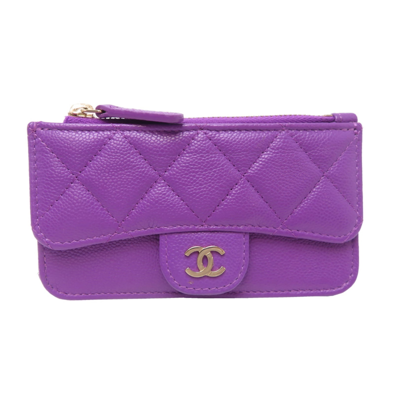 Calfskin card case by Chanel: Calfskin card case by Chanel Calfskin card case by Chanel features a rich purple hue and a classic design. Made from high-quality grained Calfskin, the compact size (7cm x 13cm) makes it perfect for e