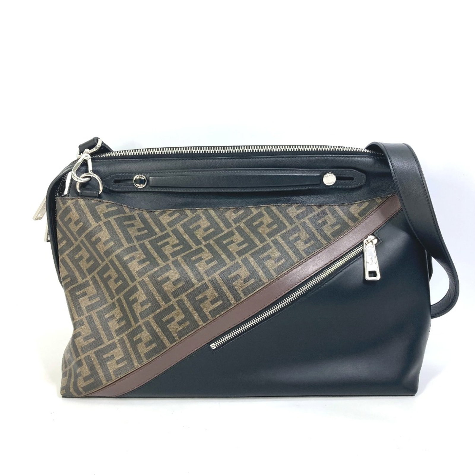 Handbag by Fendi: Handbag by Fendi Fendi's signature style shines in this elegant brown handbag, measuring 25cm x37.5cm x7.5cm and boasting a shoulder strap that reaches an impressive 42.3 inches. Crafted from