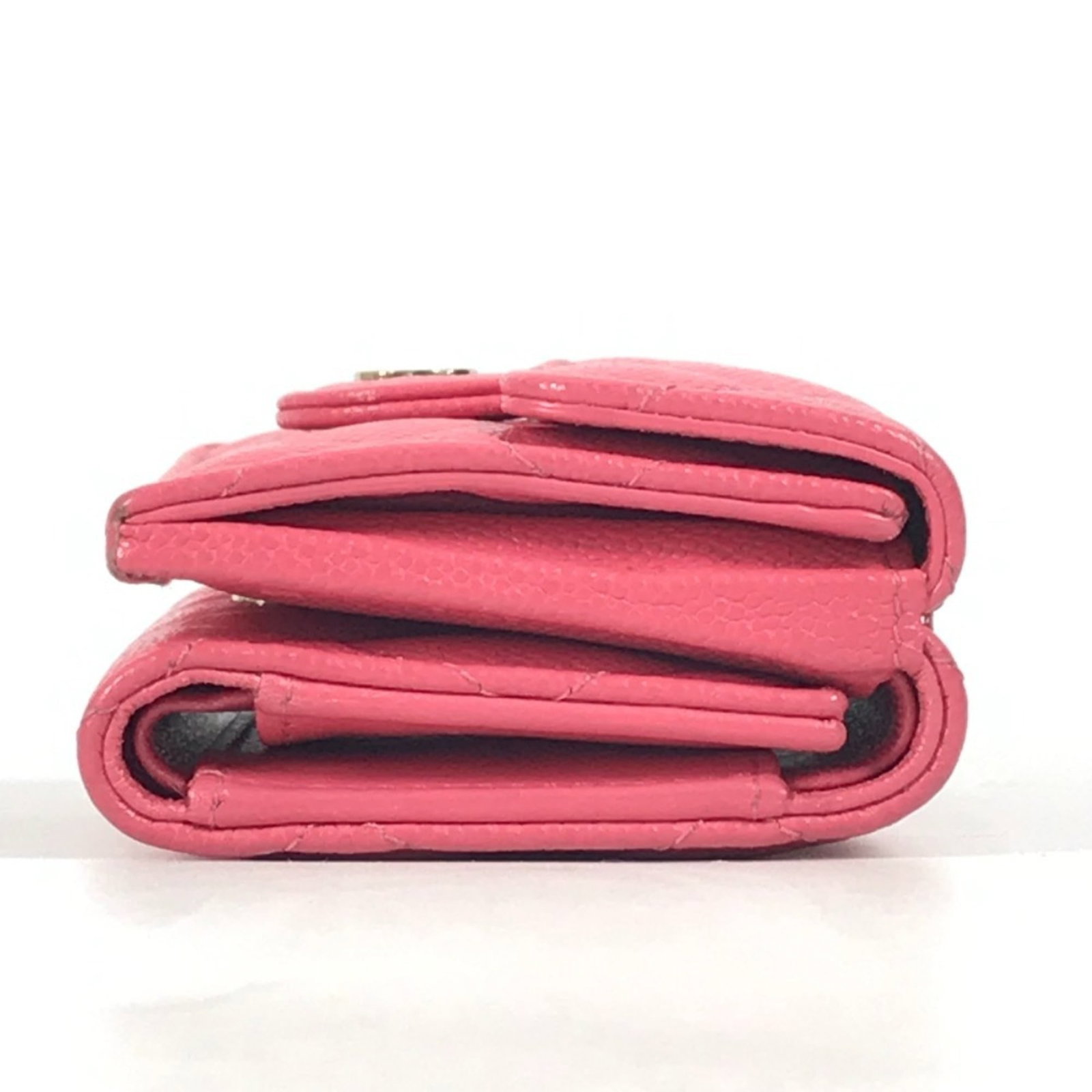 Calfskin wallet tri-fold grained by Chanel: Calfskin wallet tri-fold grained by Chanel Calfskin wallet with tri-fold design, featuring grained leather from Chanel in pink. The compact size and elegant design make it a stylish accessory for ever
