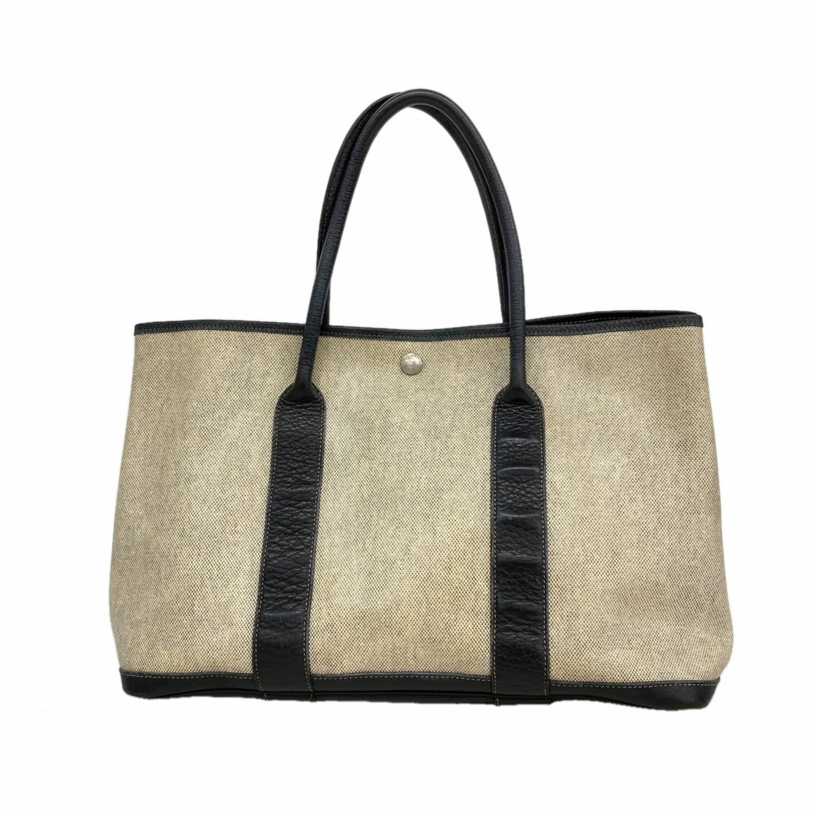 Hermes Tote Bag Toile H: Hermes Tote Bag Toile H The iconic Toile H tote bag from Herm?s, crafted in black with silver hardware and measuring 25cm x 36cm x 16.5cm, showcases the brand's signature style and attention to detail
