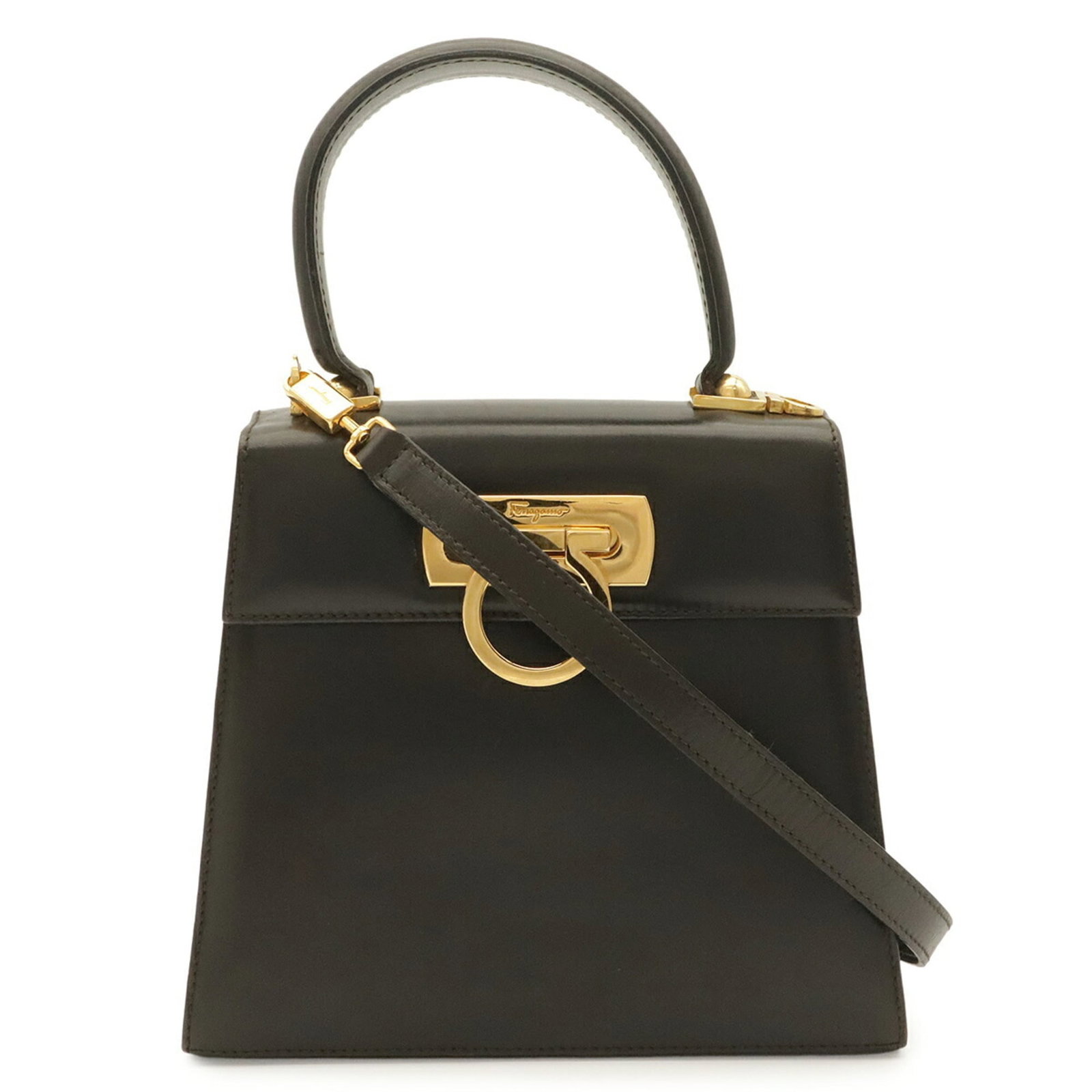 Handbag Salvatore Ferragamo Leather Shoulder: Handbag Salvatore Ferragamo Leather Shoulder This dark brown leather shoulder bag from Salvatore Ferragamo's Gancini line features a classic design with clean lines and a timeless aesthetic. Made from