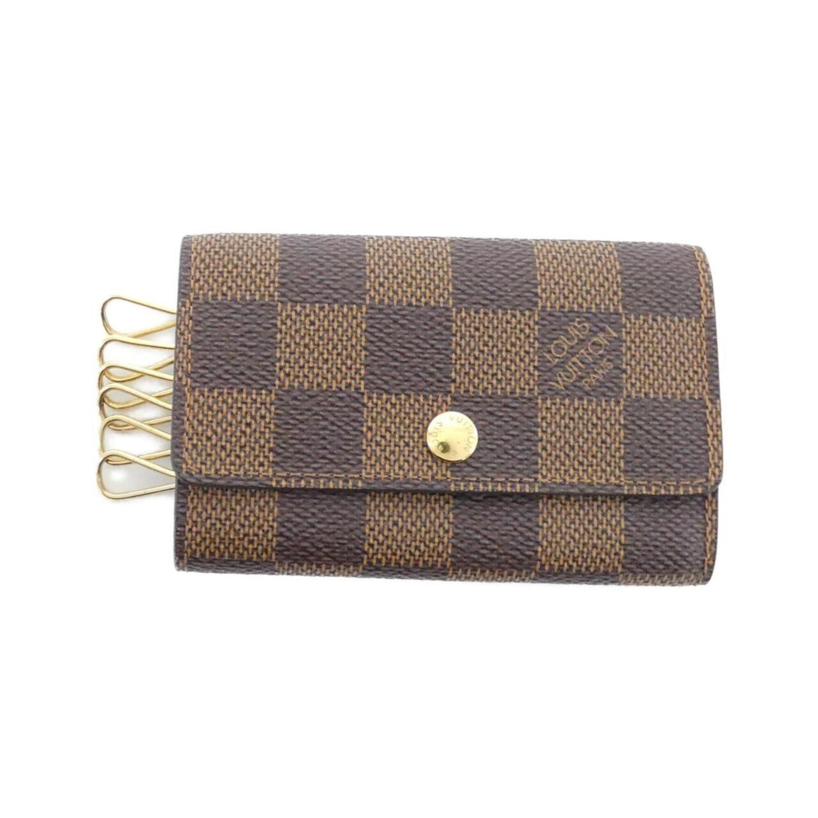 Louis Vuitton Keycase Coated Canvas: Louis Vuitton Keycase Coated Canvas Coated canvas construction provides durability and protection for your keys. This Louis Vuitton keycase features Ebene color and measures 7cm x 11cm x 1cm, making i