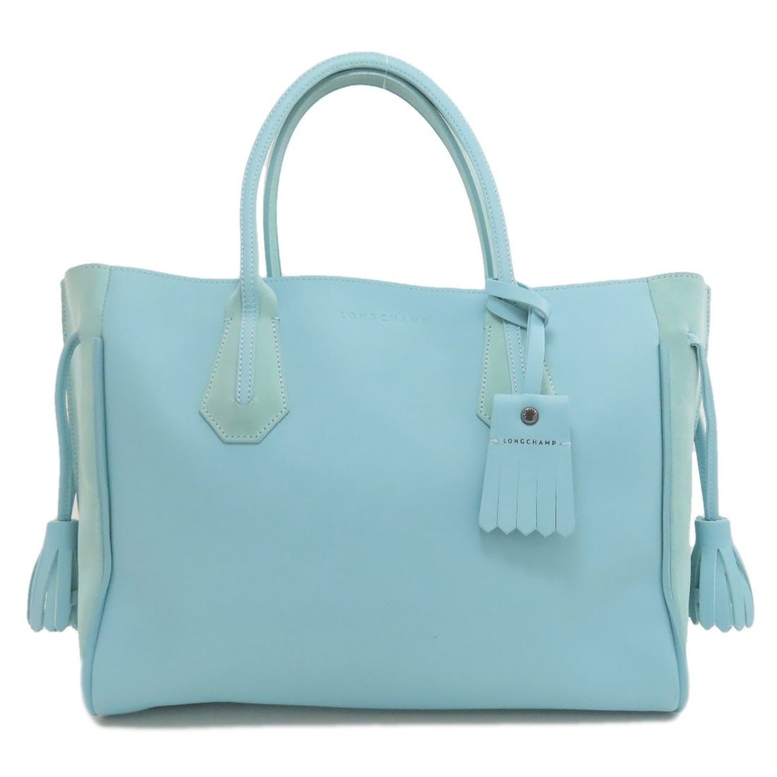 Penelope Leather Suede Longchamp Tote Bag: Penelope Leather Suede Longchamp Tote Bag Blue leather suede Longchamp tote bag with blue exterior. This style features a classic design and luxurious materials, perfect for everyday use. The bag's