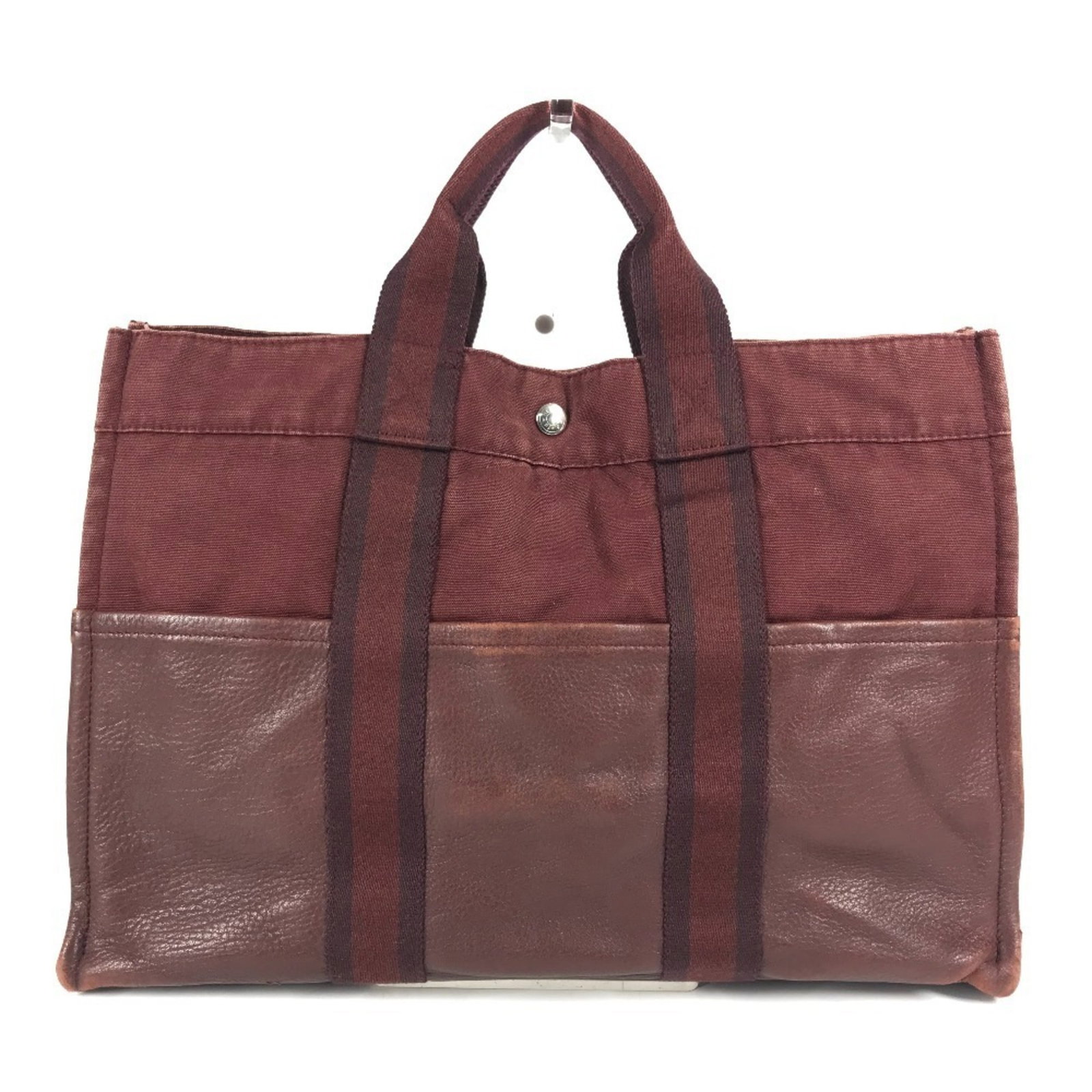 Canvas leather tote bag from Hermes: Canvas leather tote bag from Hermes Canvas leather tote bag from Hermes, featuring a vibrant red color and classic design. Made from high-quality canvas and leather, this stylish tote measures 29cm x 