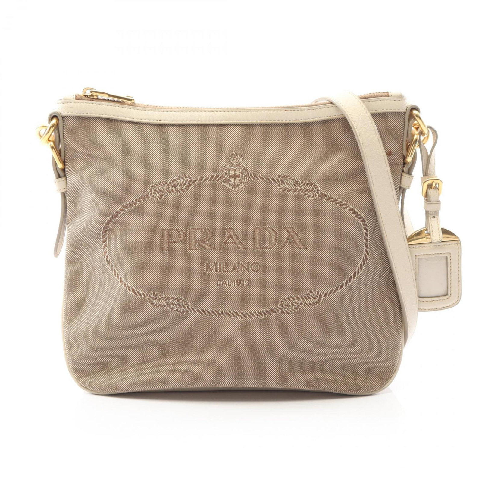 Prada Shoulder Bag Canvas Leather: Prada Shoulder Bag Canvas Leather Canvas and leather come together in this classic Prada shoulder bag, with clean lines and understated elegance. The brown and ivory color combination adds a touch of 