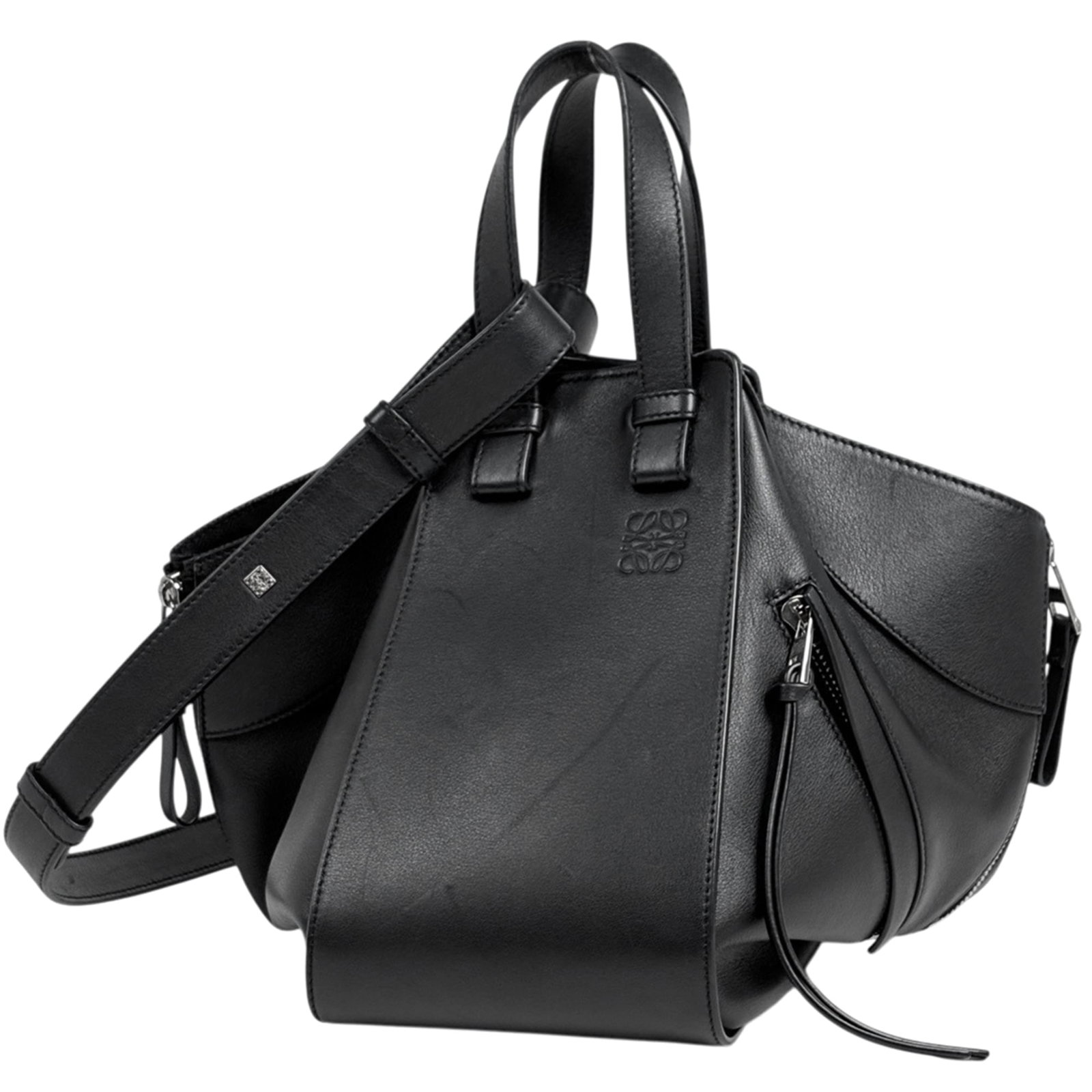 Loewe Handbag Leather: Loewe Handbag Leather Black Loewe Handbag Leather. Made from high-quality leather, this handbag measures 24cm x 13cm x 27cm and features a sleek black design. The bag's dimensions make it a compact an