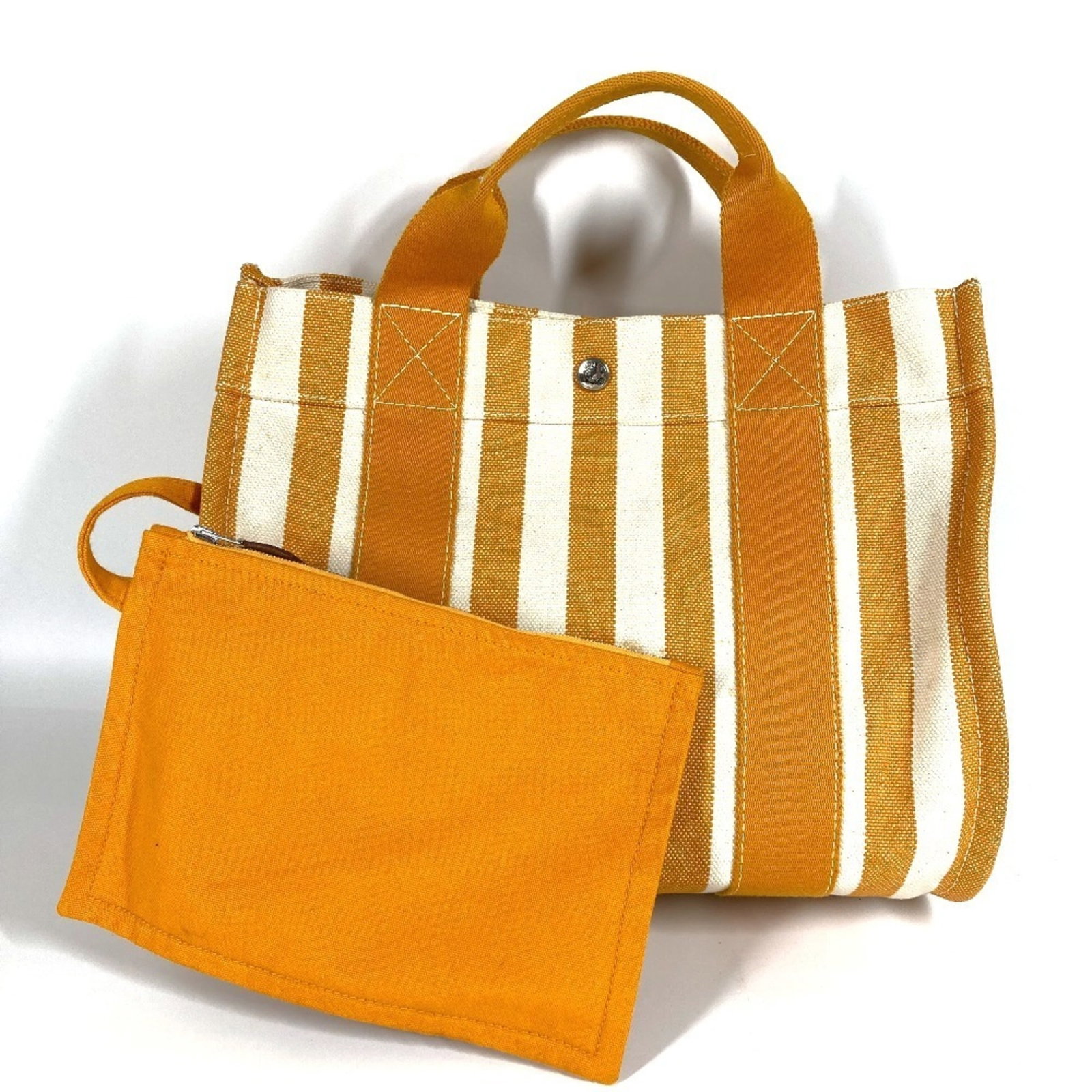 Cotton Handbag Tote Pouch Hermes: Cotton Handbag Tote Pouch Hermes Cotton Handbag Tote Pouch from Hermes, made in France with a white and yellow color combination. This tote bag features a classic design with a cotton material and