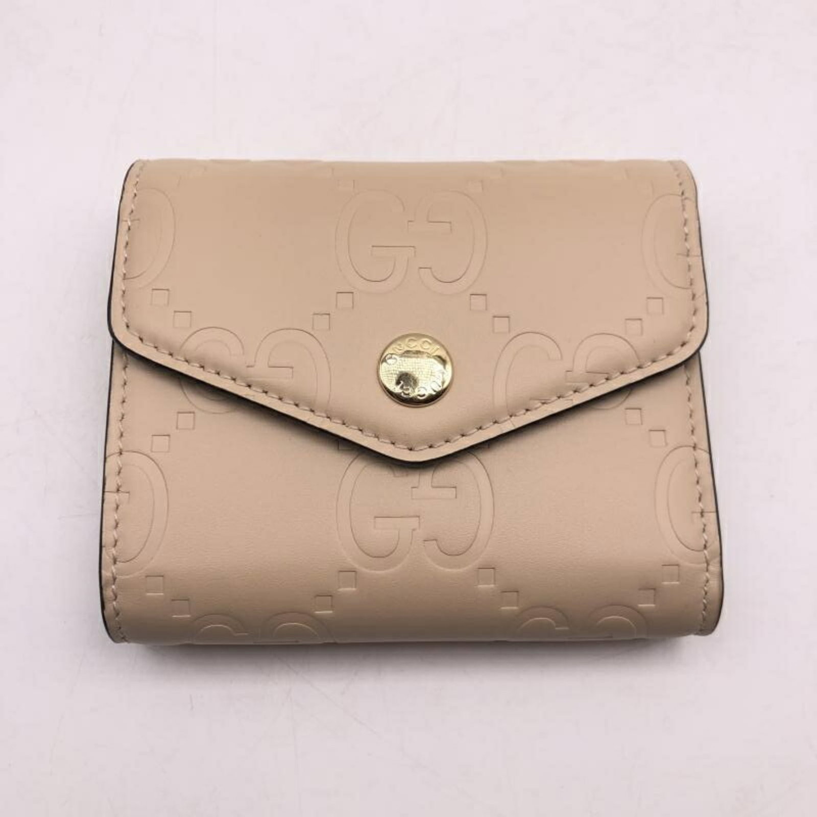 Gucci Wallet (Tri-Fold): Gucci Wallet (Tri-Fold) Tri-fold Gucci wallet with classic beige color, measuring 9.5cm x 11cm. This stylish accessory features a sleek design and sturdy construction, making it a practical choice