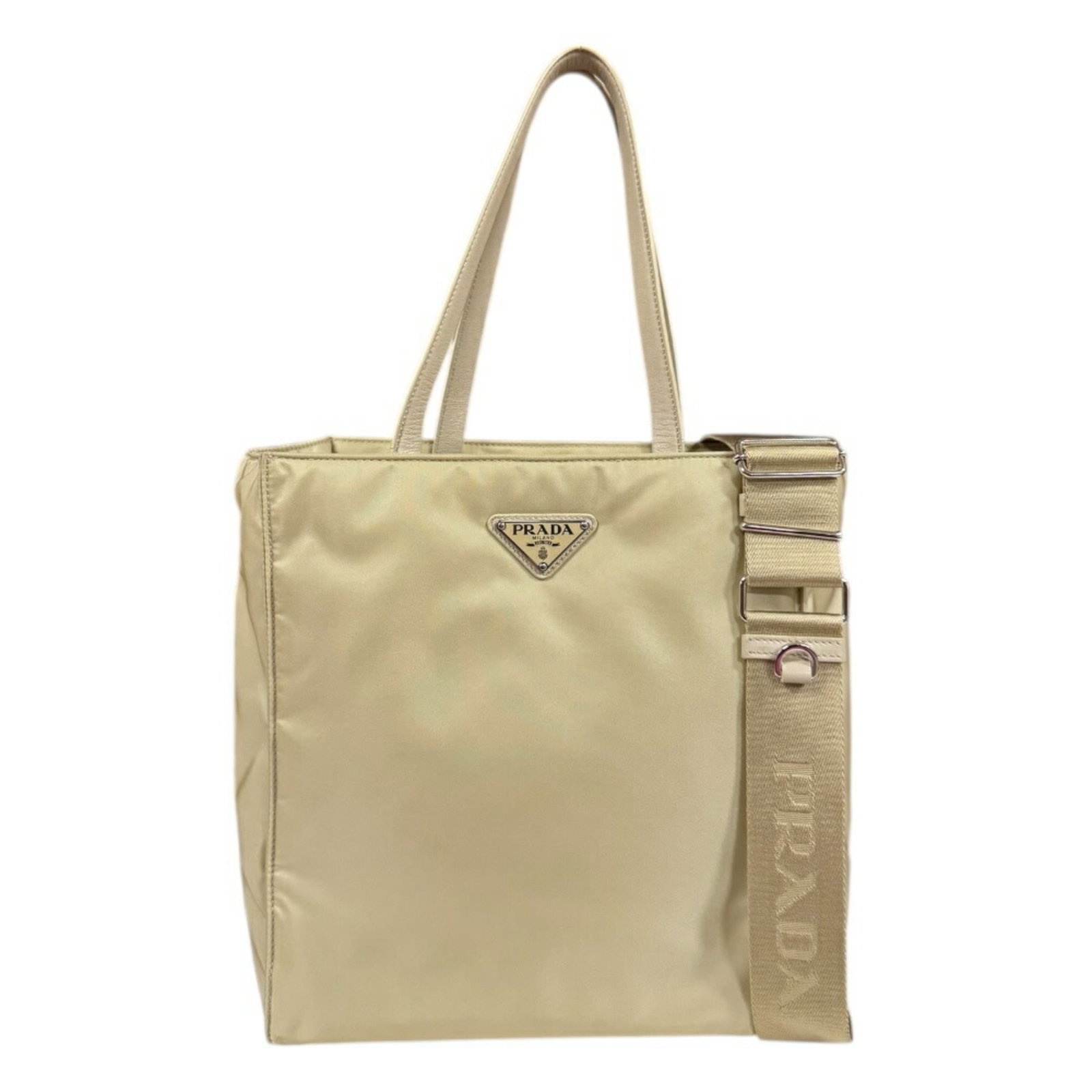Shoulder Bag Nylon Prada: Shoulder Bag Nylon Prada Prada's Nylon Shoulder Bag boasts a sleek design with clean lines and a classic silhouette. Made from high-quality nylon, the bag features a timeless beige color that compleme
