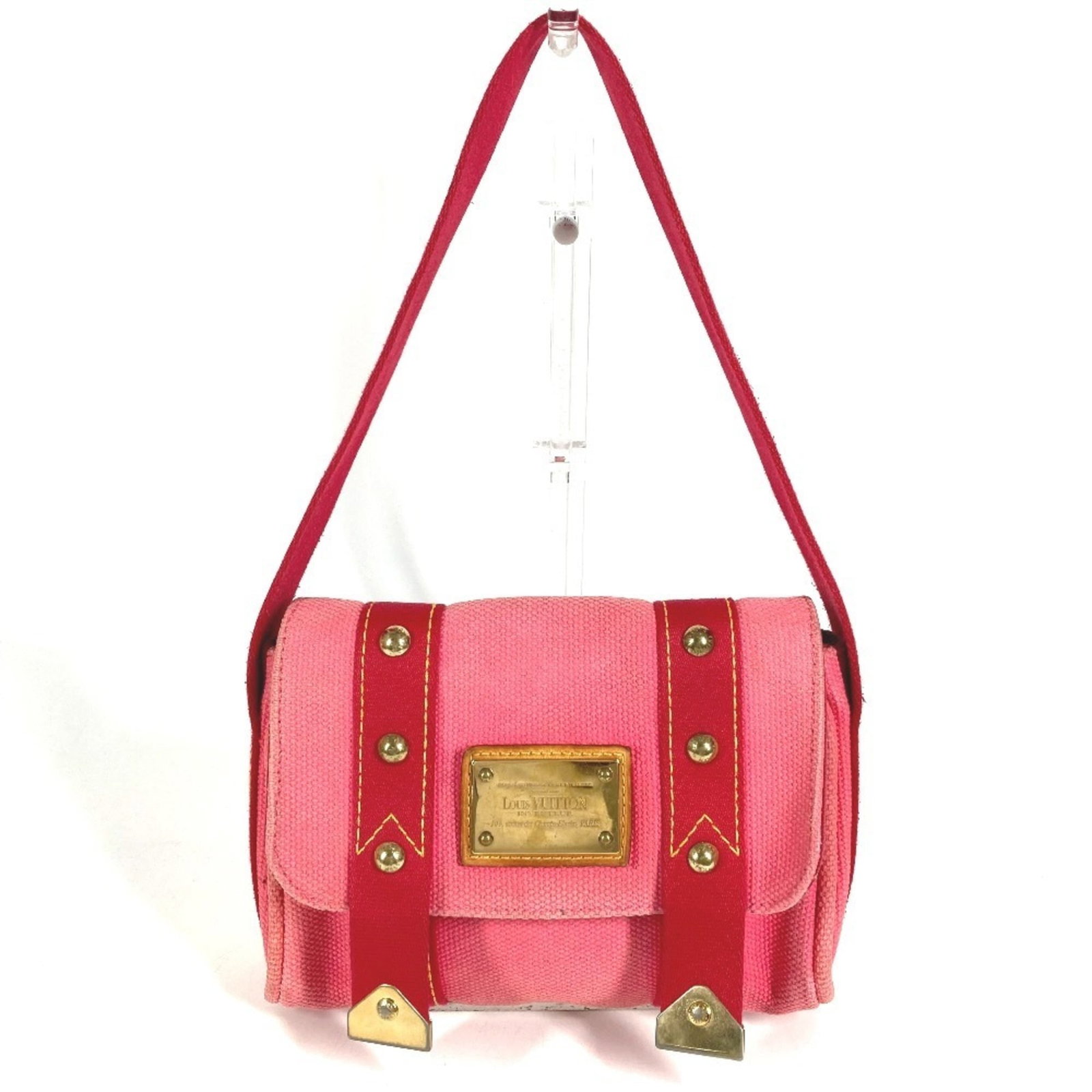 Canvas shoulder bag handbag from Louis Vuitton: Canvas shoulder bag handbag from Louis Vuitton Canvas shoulder bag from Louis Vuitton, featuring a pink canvas material and measuring 15.5cm x 22.5cm x 5.5cm in size. This handbag boasts the iconic