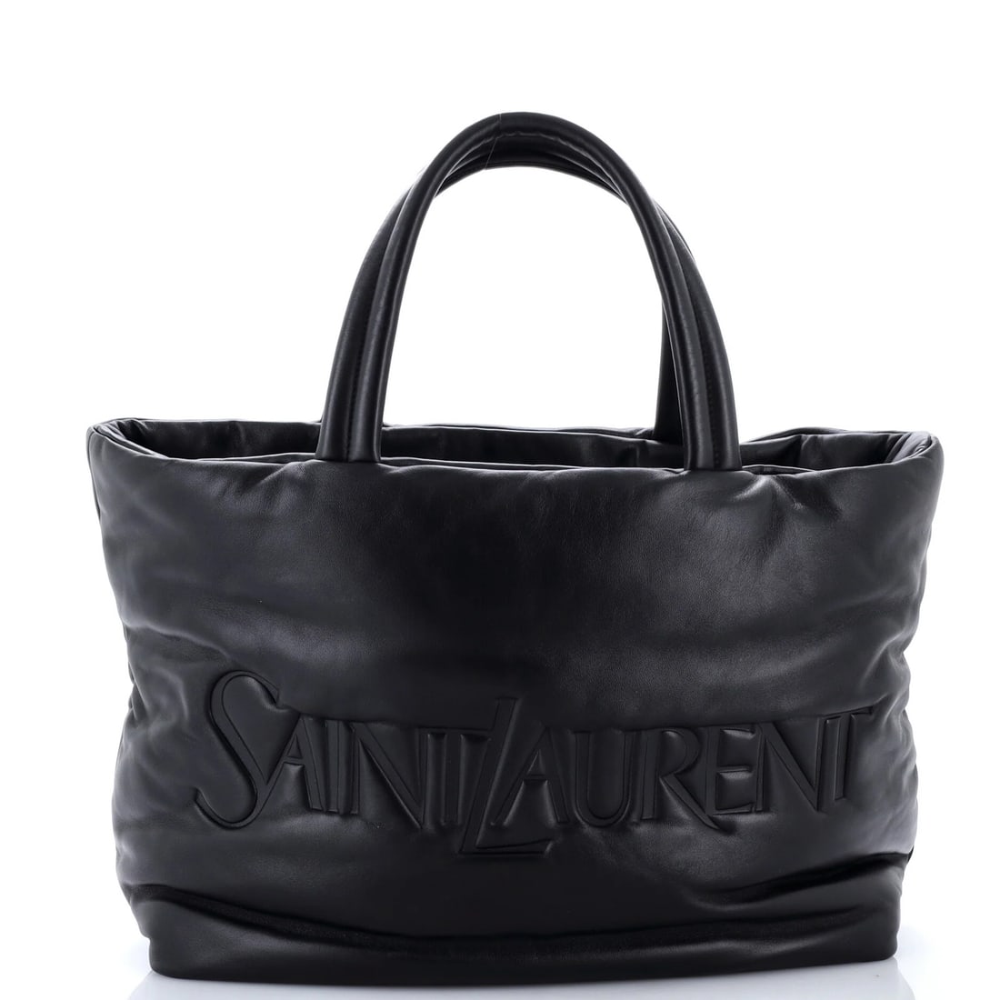 Padded leather tote Saint Laurent Debossed logo: Padded leather tote Saint Laurent Debossed logo Padded leather tote with debossed Saint Laurent logo, featuring black exterior and interior. The classic design boasts a sturdy 7" handle drop and a