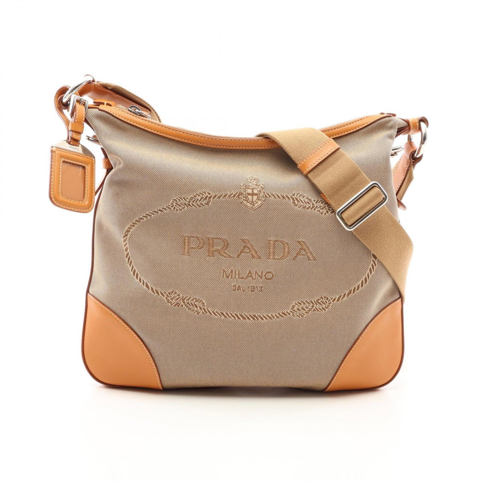 Prada Handbag Shoulder Bag Canvas Leather: Prada Handbag Shoulder Bag Canvas Leather Canvas and leather come together in this understated Prada shoulder bag, available in beige. Measuring 27.5cm x 30cm x 2cm, it features adjustable straps