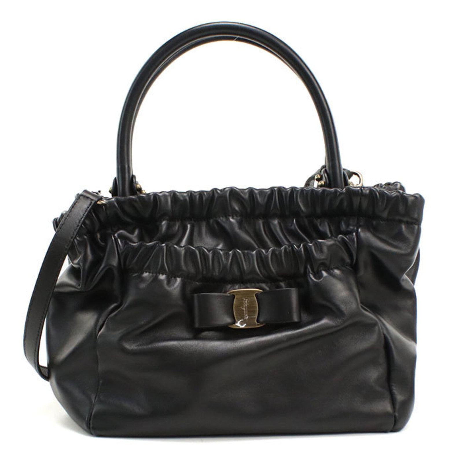 Salvatore Ferragamo Handbag Leather: Salvatore Ferragamo Handbag Leather This black Salvatore Ferragamo handbag features high-quality calfskin leather and gold hardware, showcasing the brand's signature style. Made in Italy, it boasts a