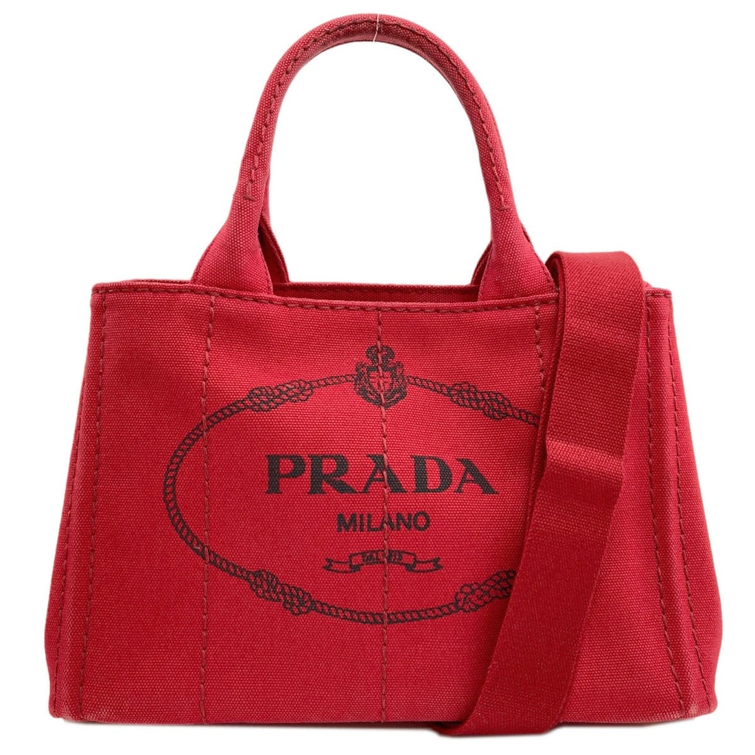 Prada Canapa Mini 2 Way Handbag Canvas: Prada Canapa Mini 2 Way Handbag Canvas Red Prada Canapa Mini 2 Way Handbag in Canvas. This mini handbag features a striking red exterior made from canvas, with a classic 2-way design that adds to its