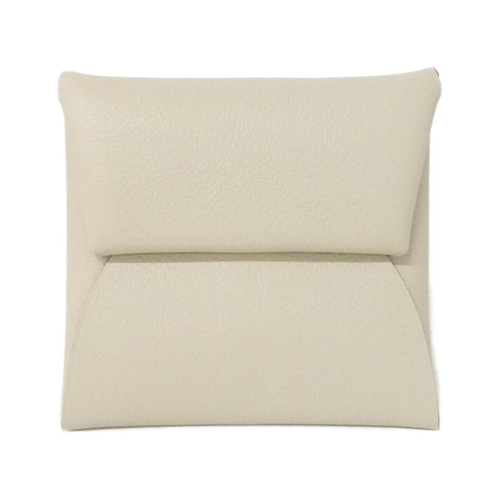 Coin purse by Hermes: Coin purse by Hermes The Hermes coin purse boasts sleek, minimalist design with clean lines and a compact size. Made from white material, it measures 8cm x 8cm x 1cm and comes in a sturdy box for adde