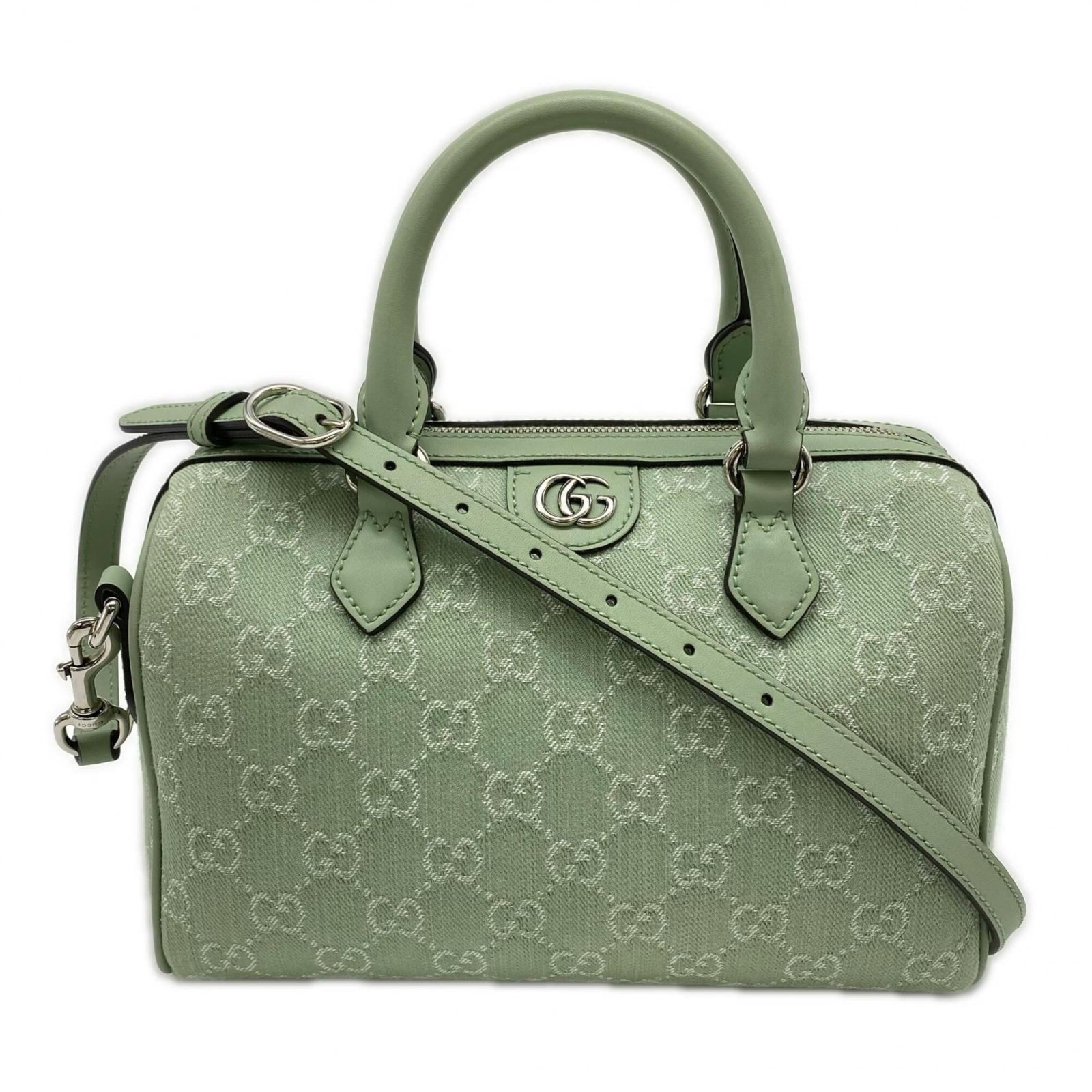 Gucci Boston Bag Handbag Canvas: Gucci Boston Bag Handbag Canvas The Gucci Boston Bag Handbag Canvas features a vibrant green GG canvas material, adding a pop of color to any outfit. With its classic design and functional zipper clos