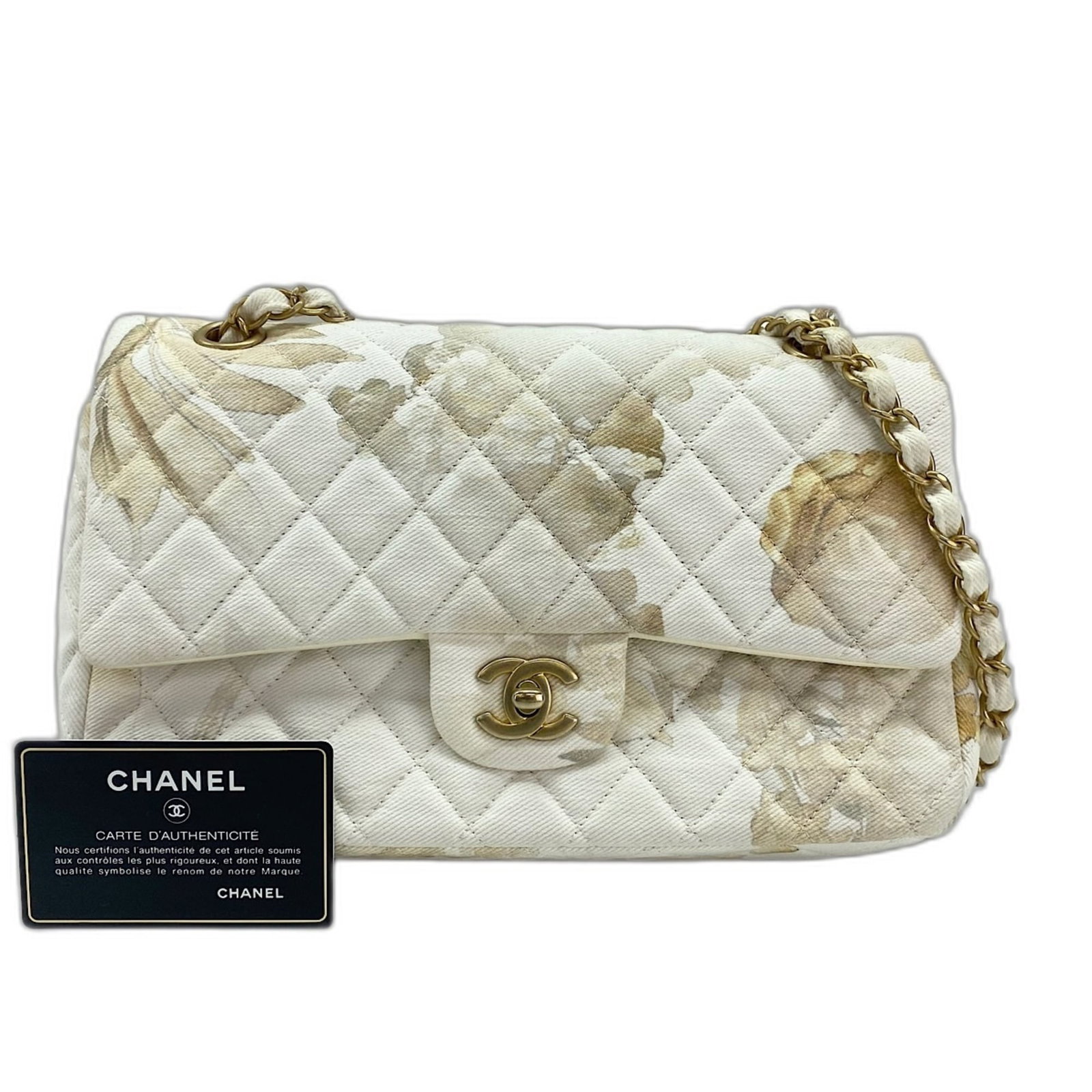 Shoulder bag canvas by Chanel: Shoulder bag canvas by Chanel Canvas by Chanel in crisp white, a classic shoulder bag with clean lines and understated elegance. The Matelasse weave adds texture to the timeless design, while the adju