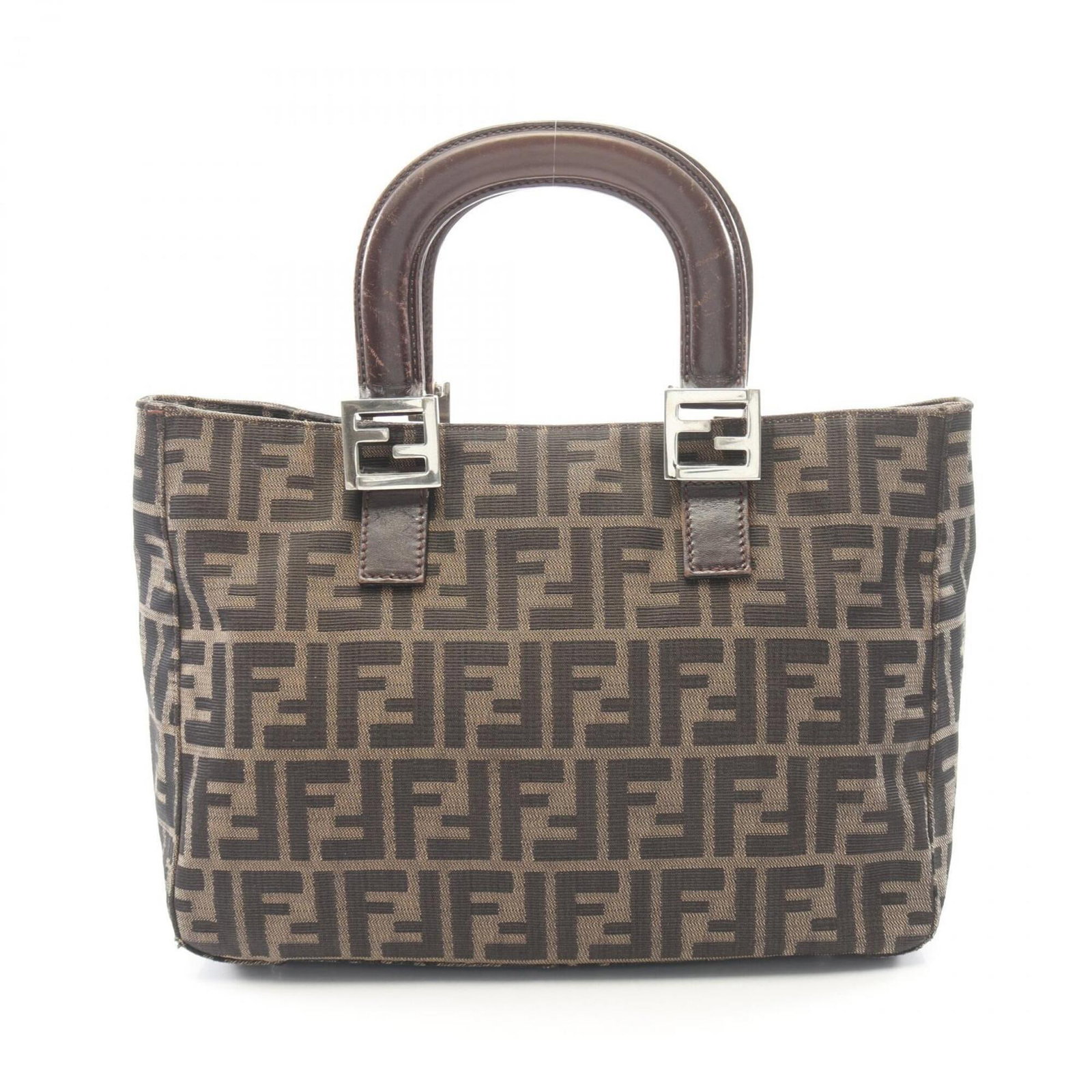 Canvas leather bag tote by Fendi: Canvas leather bag tote by Fendi Canvas leather bag tote by Fendi, featuring a sturdy canvas and luxurious leather construction in a rich brown color. The spacious interior and long handle make it a p