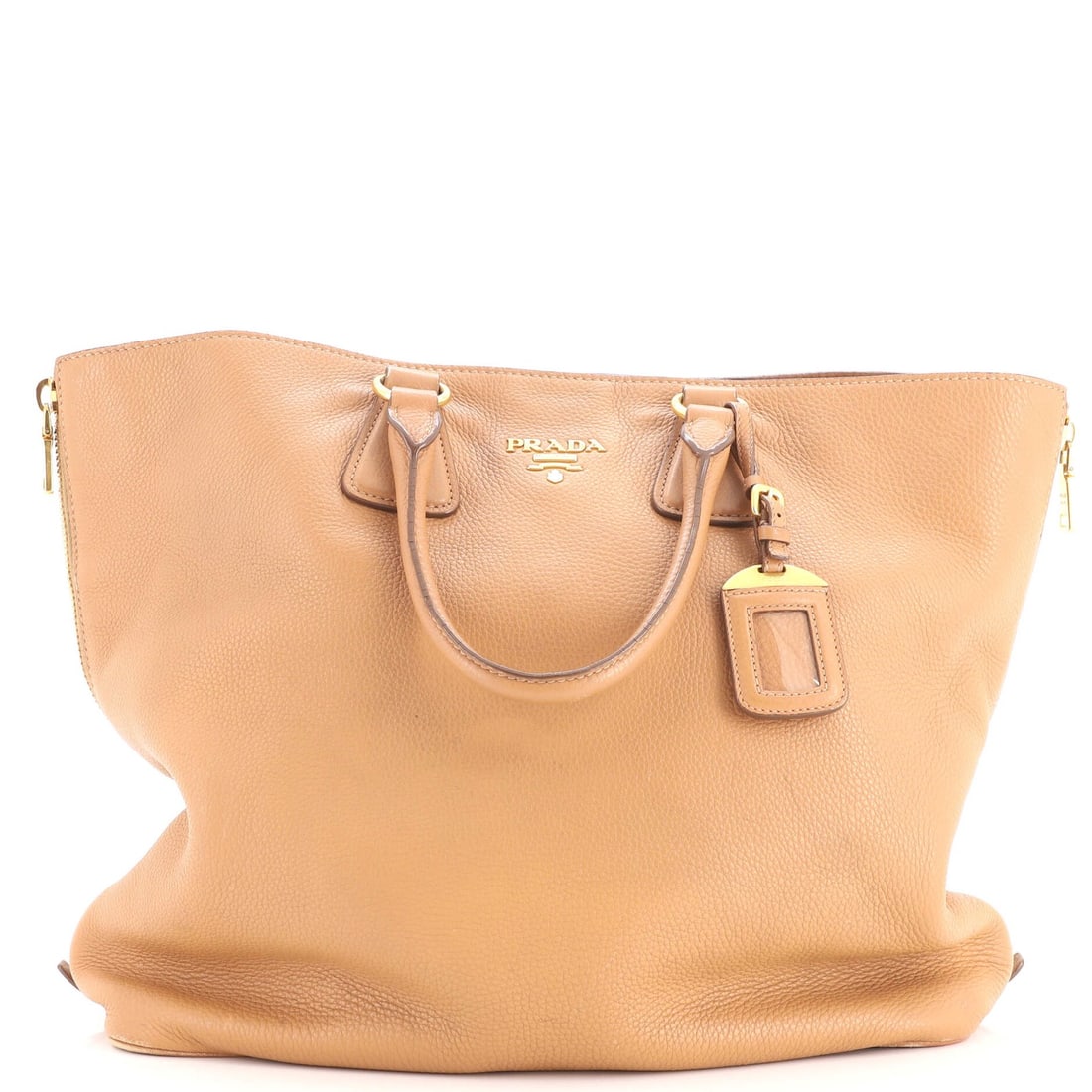 Side zip convertible tote prada daino vitello large: Side zip convertible tote prada daino vitello large Brown leather side zip convertible tote with gold hardware, featuring a large size and interior fabric lining. The exterior shows signs of heavy