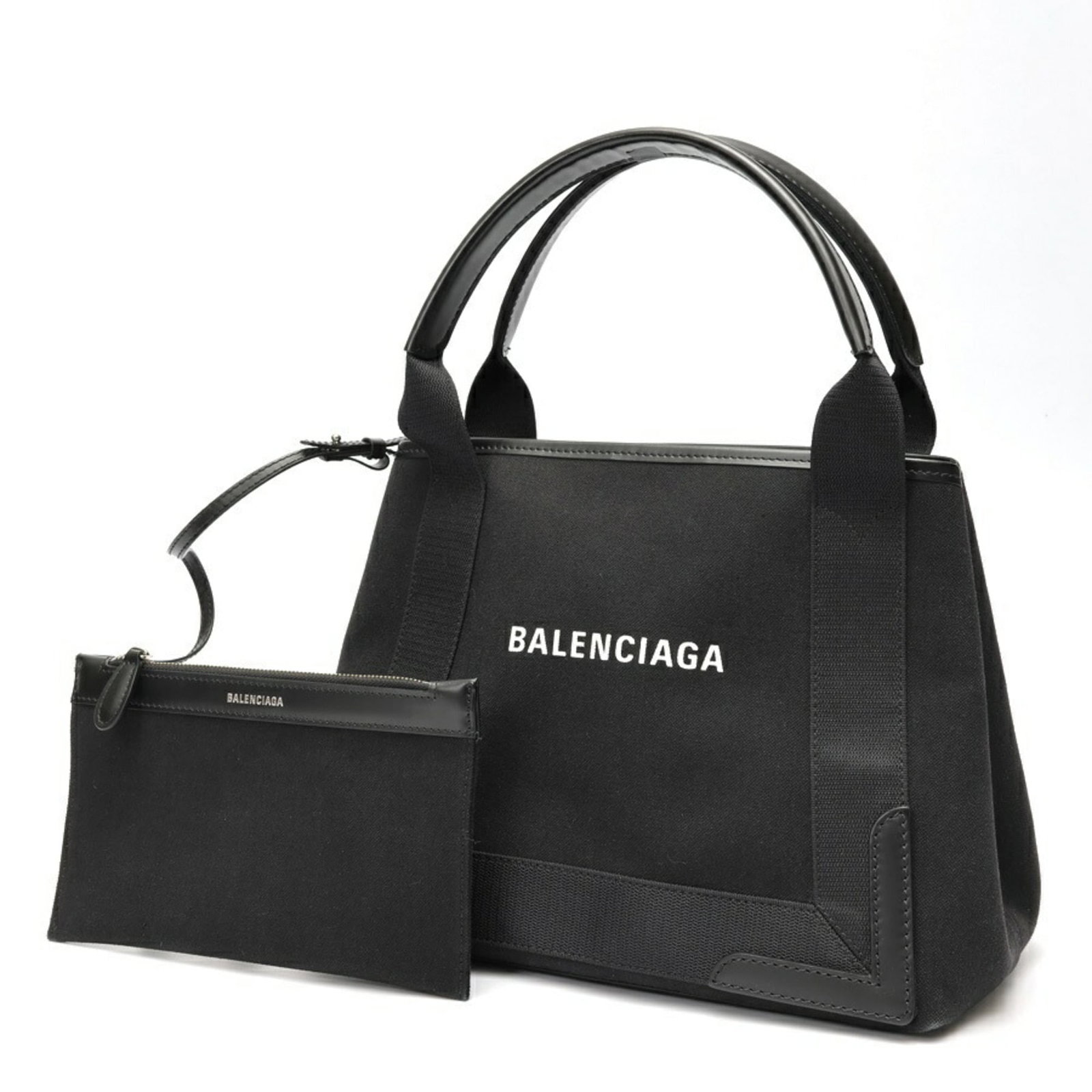 Canvas leather bag tote by Balenciaga: Canvas leather bag tote by Balenciaga Canvas leather bag tote by Balenciaga, crafted from high-quality canvas and calfskin leather. This stylish tote measures 23cm x 30cm x 18cm and features a sleek b