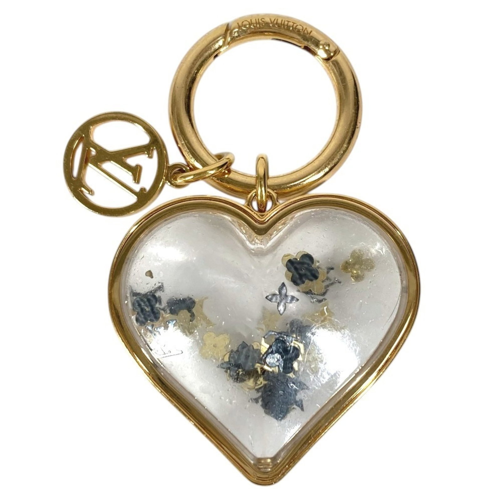 Louis Vuitton Metal Glass Keyring: Louis Vuitton Metal Glass Keyring Gold Louis Vuitton Metal Glass Keyring with a delicate charm featuring hearts. Made from high-quality glass and metal, this elegant keyring showcases the iconic Louis
