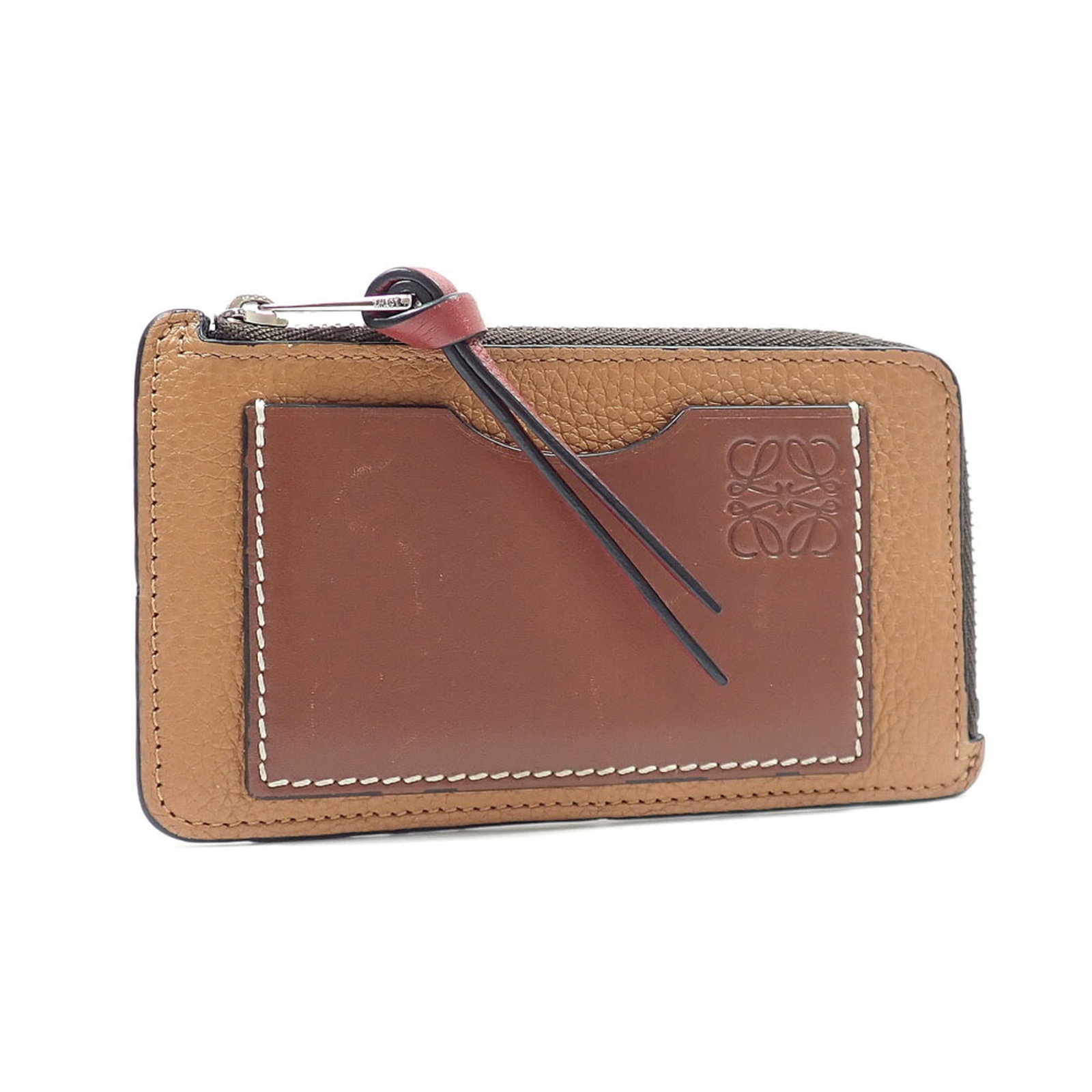 Coin Case Leather Purse Loewe: Coin Case Leather Purse Loewe This luxurious Loewe coin case purse features rich brown leather and precise dimensions, measuring 7cm x 12.5cm x 1cm. The classic design showcases the brand's signature