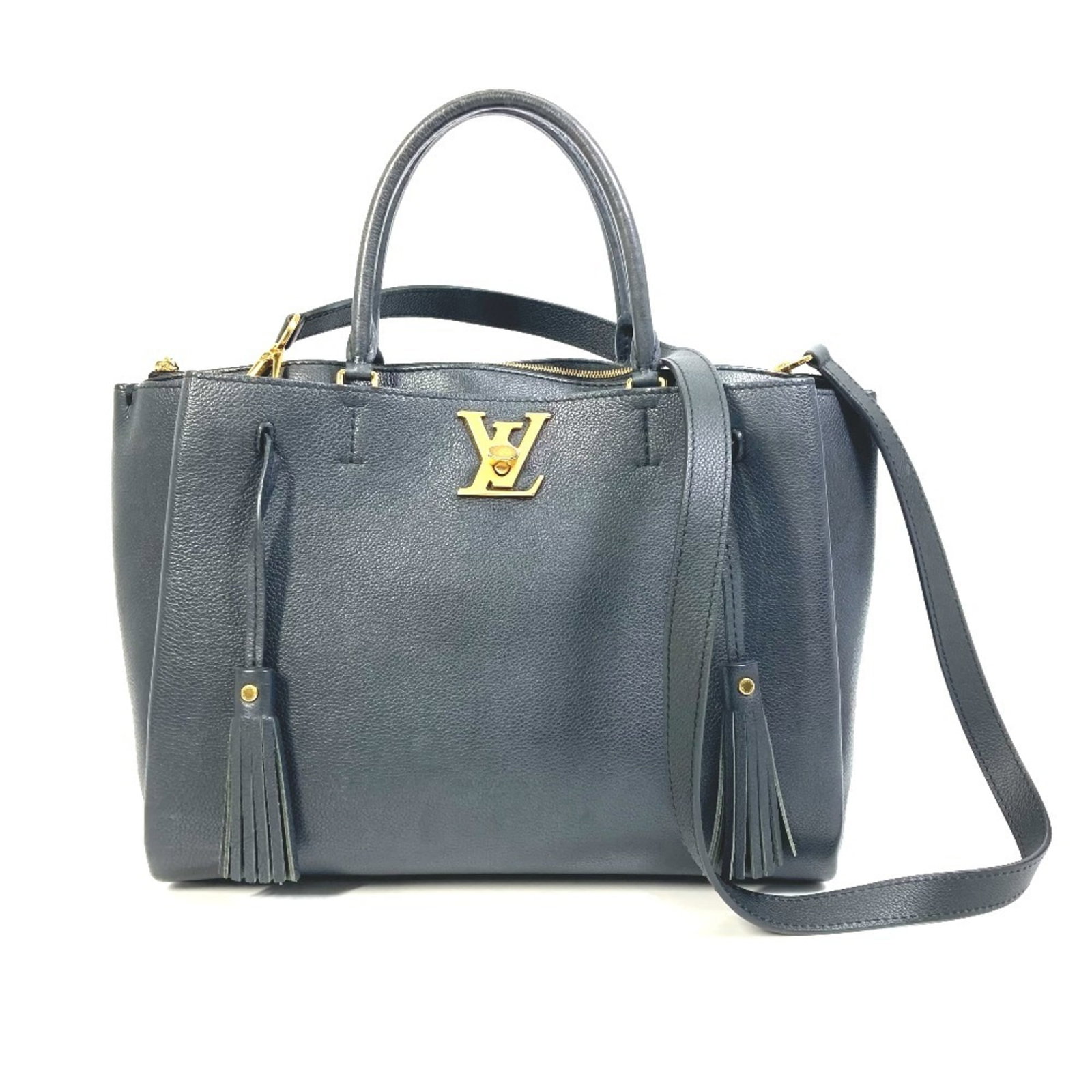 Leather tote bag by Louis Vuitton: Leather tote bag by Louis Vuitton Black leather tote bag by Louis Vuitton, crafted from high-quality calf leather and featuring gold hardware, includes a dust bag and adjustable shoulder strap. The