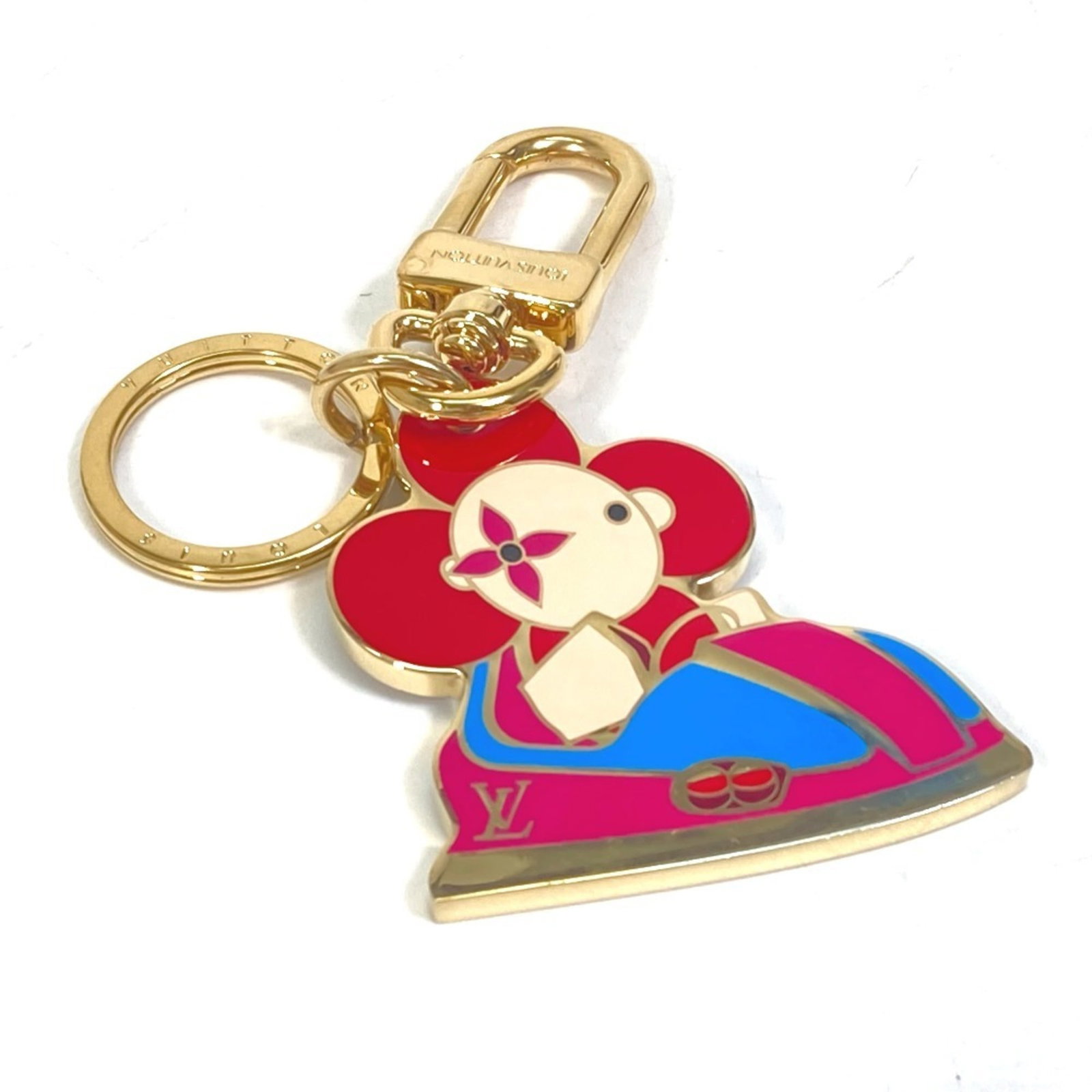Keyring Metal By Louis Vuitton: Keyring Metal By Louis Vuitton Gold Metal Keyring by Louis Vuitton, 10.5cm x 5cm, comes with box and dust bag. This keyring features the iconic Louis Vuitton design in metal form. A stylish accessory
