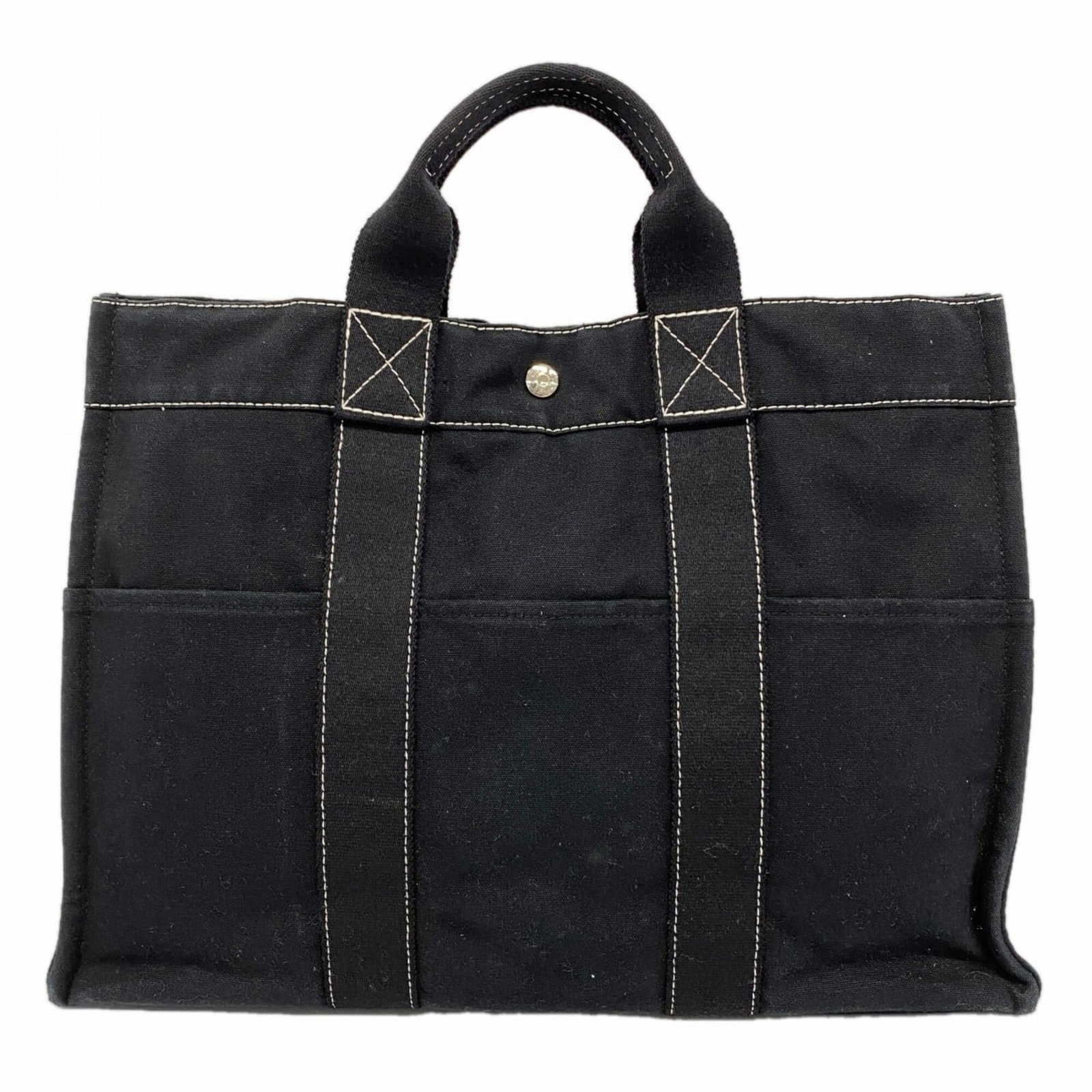 Canvas Hermes Tote Bag: Canvas Hermes Tote Bag Canvas tote bag from Hermes, crafted from high-quality canvas material and featuring silver hardware. Measuring 32cm x 43cm x 10cm, it offers a classic and timeless design. With