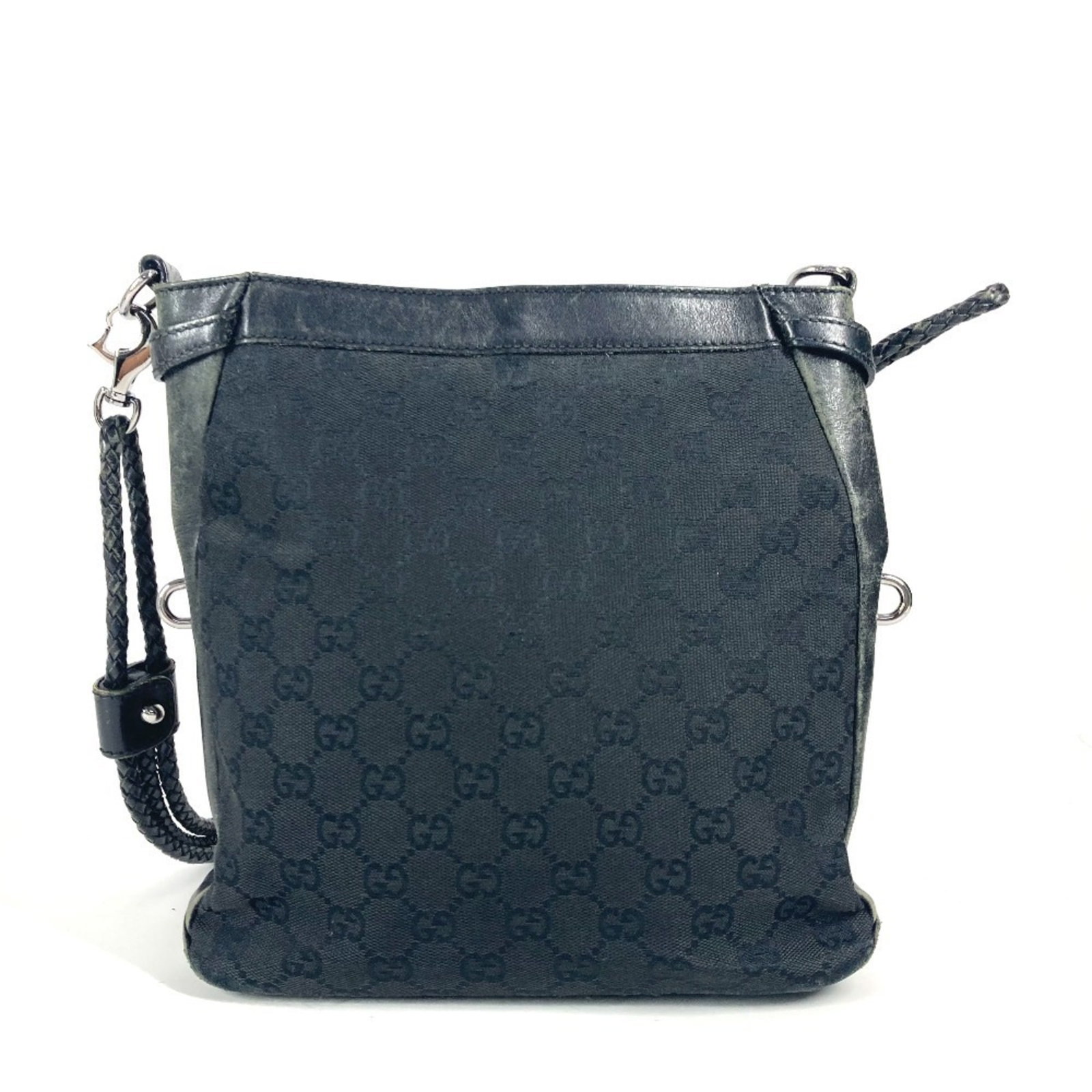 Shoulder Bag Canvas Leather Gucci: Shoulder Bag Canvas Leather Gucci GG canvas and leather combine in this sleek black shoulder bag from Gucci, measuring 24.5cm x 24cm x 5.5cm. The simple design showcases the iconic GG pattern, a