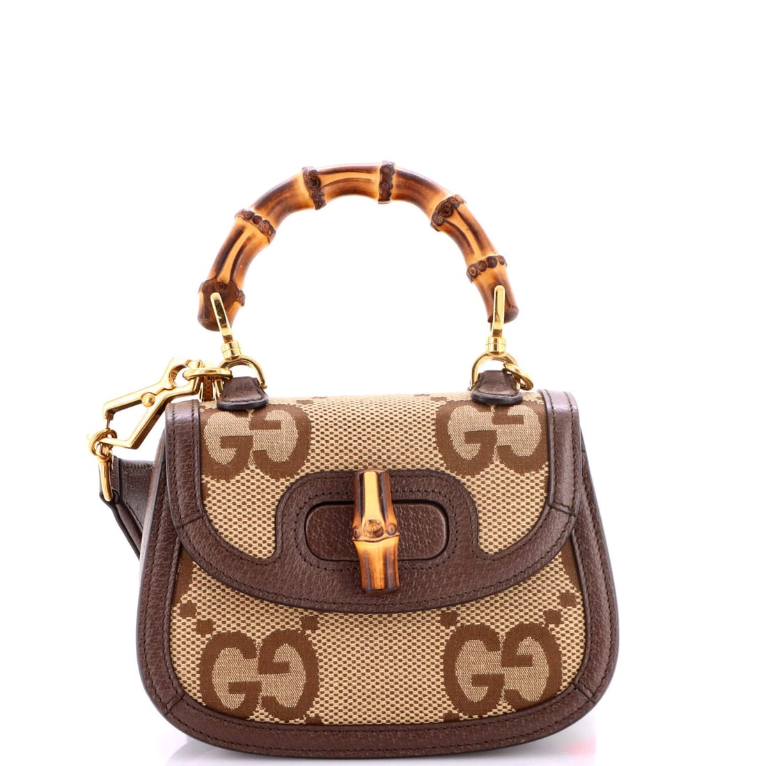 Gucci 1947 bamboo top bag mini jumbo handle GG canvas: Gucci 1947 bamboo top bag mini jumbo handle GG canvas The Gucci 1947 Bamboo Top Handle Bag in brown canvas features the iconic GG logo, making it a stylish and timeless accessory. Measuring just 5" ta